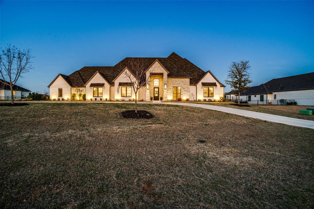 Single-story luxury estate on 1.01 acres with NO MUD and NO PID taxes just minutes from Prosper and Frisco. This exceptional Dave Williams Custom Home offers the privacy of acreage living with city conveniences including City Water, City Sewer, and Natural Gas.  Designed for both everyday comfort and entertaining, the home features 5 spacious bedrooms—each with its own ensuite bath—plus a private study, media room, activity room with wet bar, and powder bath for pool guests. Expansive living spaces showcase beamed ceilings and a dramatic wall of sliding glass doors, creating seamless indoor-outdoor living and filling the home with natural light.  The chef’s kitchen is built for entertaining with Wolf appliances, Sub-Zero refrigerator, oversized island, and a large walk-in pantry with built-in microwave and motion lighting.  Smart home technology enhances everyday living with a Control4 system, with optional Josh AI voice control, managing lighting, climate, sound, and security throughout the home.  The private primary suite offers a true retreat with dual walk-in closets, a spa-inspired bath with steam shower and dual vanities, a separate laundry area off the primary suite, and a coffee bar.  Enjoy movie nights in the dedicated media room with 120-inch screen, Sony projector, and leather recliners, while a hidden bookcase connects two secondary bedrooms.  Additional highlights include a tornado shelter, dual utility rooms, server closet, full Texas attic with interior staircase, and a 4-car garage with polyaspartic floors.  The resort-style backyard features a pool, spa, outdoor kitchen with Big Joe grill and griddle, beverage refrigerator, automated shades, fireplace seating areas, and lush landscaping.  Luxury acreage living with advanced technology and resort-style amenities—rarely available this close to Prosper and Frisco.