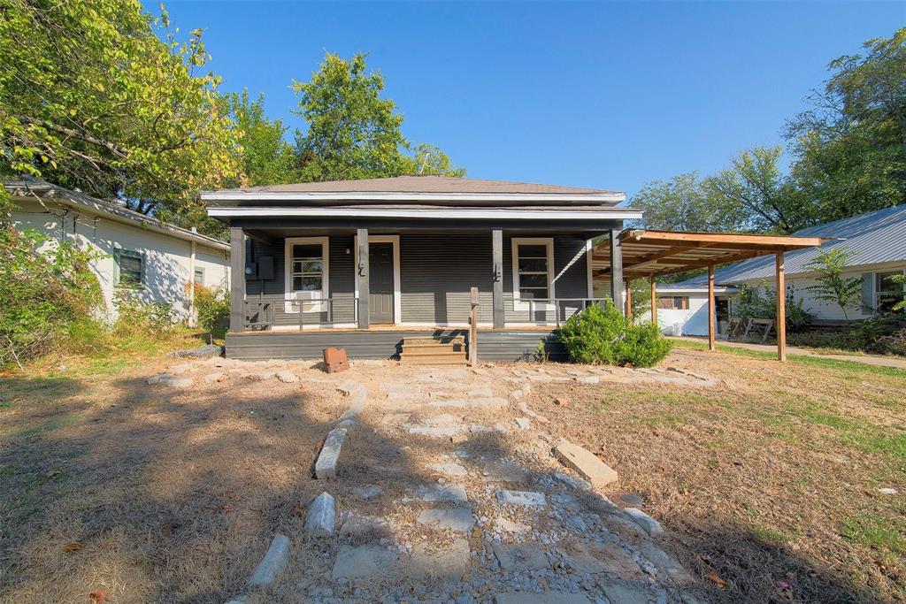 Cute, cozy, and move in ready. This darling 2 bed, 1 bath home has potential. It features a large covered front porch, vinyl flooring throughout and new ceiling fans. Good sized lot with a large, fenced in back yard with mature trees. House features an attached carport. Schedule your showing today. SELLER FINANCING AVAILABLE