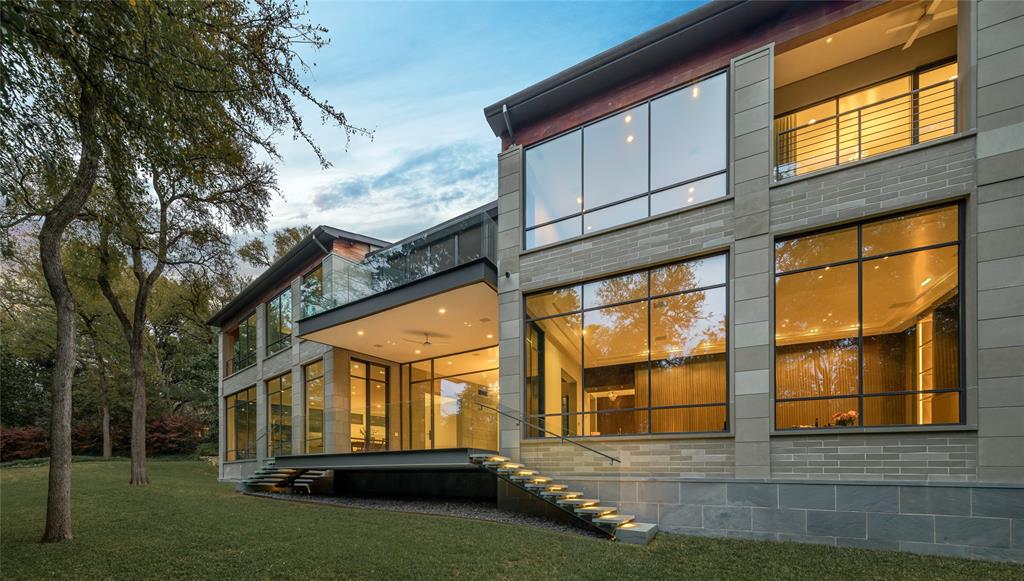 Tucked back on a cul-de-sac in the Devonshire estate area, this gem is a chance to own one of architect Bill Booziotis’ final designs. Custom-built by Sebastian Construction Group, the 6,954sqft, 2-bed, 3.3-bath estate was meticulously designed to enjoy the surrounding natural beauty of the creekside .93-acre lot. Floor-to-ceiling steel windows throughout provide views of the lush landscape. On the first level find a living room and wet bar, a kitchen w-a working pantry-culinary center, and a family room and dining area w-picturesque views. The second level boasts a primary wing with his-and-her spa-like baths, 2 walk-in closets, and a balcony. A sizable office, a guest suite, an exercise room, & a screened-in porch round out the second floor. Outside, a private oasis is complete with a loggia & multiple seating areas. Other notable elements include an elevator, a 2-car garage with AC, level-5 paint finish, Control4, electric shades, a basement, and a premier unsurpassed location.