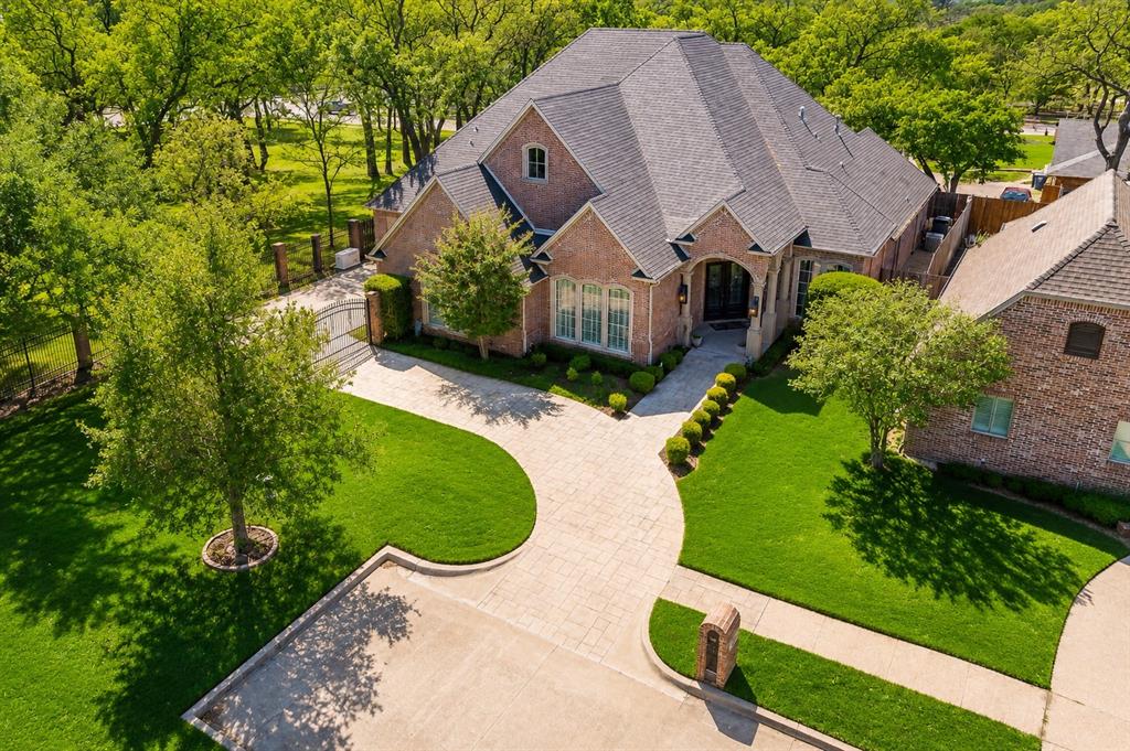 MOTIVATED SELLER – PRICED BELOW RECENT APPRAISED VALUE! Rare opportunity to own a stunning custom home tucked away at the end of a quiet cul-de-sac with peaceful greenspace views and just steps from Bicentennial Park.  This meticulously maintained home offers hand-scraped wood floors, a beautiful coffered-ceiling study with custom built-ins, and an open-concept design perfect for everyday living and entertaining. The chef’s kitchen features custom cabinetry, granite countertops, an oversized island, and a built-in ice maker.  The spacious primary suite provides a private retreat, while upgrades including surround sound, a wet bar, foam insulation, and a Generac whole-home generator add comfort and peace of mind.  Enjoy your own backyard oasis with a covered patio, built-in DHS grill, outdoor fireplace, and multiple entertaining areas overlooking beautifully landscaped grounds and tranquil greenspace. Conveniently located near shopping, dining, and major highways. Seller is motivated and welcomes offers!