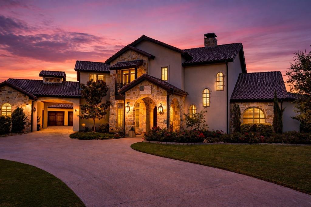 Welcome to 195 Angelina Drive, an extraordinary custom estate set on more than two acres in the prestigious, gated La Madera community in Aledo, Texas. Built in 2018, this exceptional residence blends timeless architecture with refined modern luxury, offering over 5,500 square feet of thoughtfully designed living space.

From the moment you arrive, the elegant stone and brick façade, circular drive, and manicured grounds create a striking first impression. Inside, soaring ceilings, rich hardwood floors, and walls of windows fill the open floor plan with natural light. The expansive living area is anchored by a grand fireplace and wood-beamed ceilings, flowing seamlessly into the chef’s kitchen—ideal for both daily living and entertaining.

The kitchen features a massive quartz island, professional-grade stainless steel appliances, double ovens, custom cabinetry, and a walk-in pantry. A formal dining room and generous breakfast nook provide flexible gathering spaces.

The private owner’s retreat offers a spa-inspired bath with a freestanding soaking tub, oversized walk-in shower, dual vanities, and an impressive custom closet. Secondary bedrooms include en-suite baths, while a dedicated office, game room, large utility room, and ample storage complete the interior.

Outdoors, enjoy a covered patio and expansive backyard, highlighted by 15 mature peach trees producing fresh fruit each season. Located in highly acclaimed Aledo ISD and minutes from Fort Worth, this home offers luxury, privacy, and convenience—an exceptional opportunity in one of the area’s most sought-after communities.