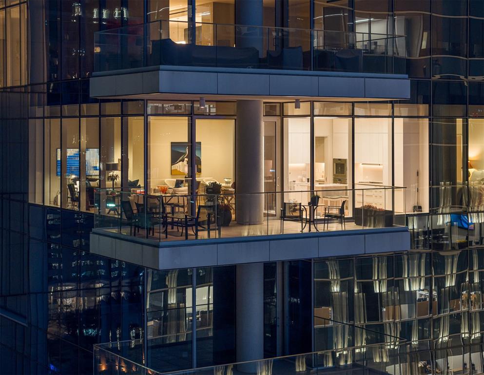 Elevated above the cultural heartbeat of the city, this one of a kind three-bedroom residence at HALL Arts Residences offers an effortless blend of architectural sophistication, gallery-caliber interiors, art-ready lighting, custom built-ins, and cinematic views over the Dallas Arts District. Encompassing 2,923 square feet this home is framed by floor-to-ceiling glass windows that capture morning light, glowing sunsets, and the sparkling skyline by night — a true sanctuary in the sky.

The open living and dining flows seamlessly to a private, covered terrace. The sleek chef’s kitchen features bulthaup cabinets, Gaggeneau appliances and sightlines to the downtown skyline.

The spa-inspired primary suite bath is wrapped in marble, dual vanities, medicine cabinets and custom walk-in closet. Two additional ensuite bedrooms. Electric blackout draperies are offered in all bedrooms.

Residents of HALL Arts enjoy true five-star hospitality: on-site concierge services, 24-7 valet, house car service, private wine storage, fitness studio, dog spa and serene treatment room. The resort-style infinity edge lap pool, putting green, gas grill and fire pits create an outdoor oasis. HALL Arts Residences is Gold LEED rated and prioritizes health as a WELL Certified residence. Three parking spaces and one climate-controlled storage room.