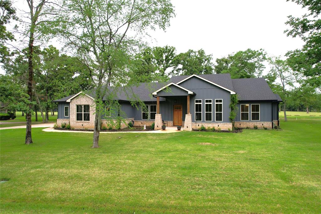 Beautiful custom home built in 2022 located in The Links at Land’s End on Lake Fork. This 3 bedroom, 2.5 bath home also features a dedicated office and sits on just over half an acre along the #3 fairway, with great views of holes 2 and 3. Inside you’ll find vaulted ceilings in the living room and primary bedroom, large bedrooms throughout, and a spacious pantry that offers plenty of storage. The screened-in porch and oversized back deck make it easy to enjoy the golf course setting year-round.

The 3-car garage is 25 feet deep, giving you plenty of room for vehicles, a golf cart, or boat storage. Located just a short distance from the clubhouse, residents enjoy access to golf, dining, and a variety of social activities. This is a great opportunity to own a newer build in one of Lake Fork’s most desirable communities.