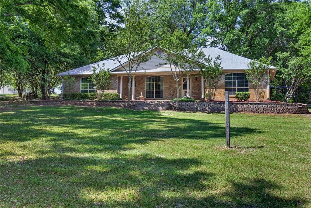 Country living at its finest on 9 acres !! Custom Ranch Style Home. 3 bedrooms 2 bath. Primary offers private bath, double vanity, soaking tub, walk-in closet w hidden gun or safe room. 2 guest rooms have great space. Open floor plan. Laundry room w built in cabinets and folding area.  Large Spring Fed Pond. 30 X 50 Shop on slab w 2 roll out doors with shelving and workbench, LED lighting. Screened in Gazebo on slab w electric outlet, cover patio surrounded by the flower garden. Water well for irrigation.  Storm Shelter. Pull through driveway with covered carport. Fenced area allows plenty of space for your furry friends to roam free. Bring your ATVs and 4 wheelers along w your fishing poles to enjoy the rest of the property...making trails and going on an adventures while trying to catch a fish or maybe even two!!! This one checks all the boxes if you are looking for space...privacy....and a piece of country style living !!! Located minutes from Cedar Creek Lake ....Pinnacle Golf Club....Dining and Entertainment !!! On a dead end road, No drive thru traffic to worry about !! Come tour this one today !!