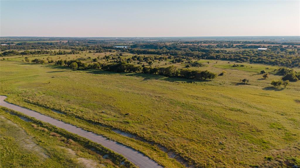 Discover the perfect blend of convenience and tranquility with this 2.213 acre property located just minutes form Interstate 35. Tucked away in a quiet area, this spacious tract of land offers plenty of room to bring your vision to life. Enjoy the peace of country living while still being able to easily reach shopping, dining, and major highways for an effortless commute. This property provides the ideal canvas for your dream home.