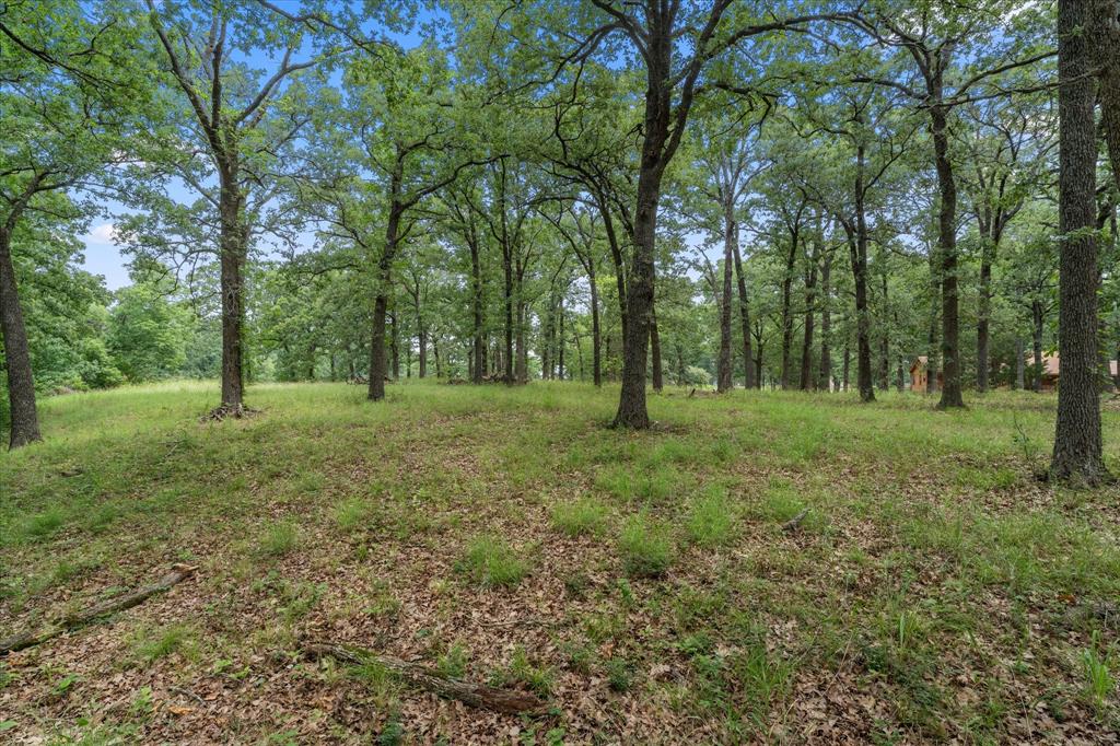 Your own piece of paradise! 1.806 acres of heavily treed, waterfront bliss. Escape the crowds and come build your new lake place among some of the finest on Richland Chambers Lake. April Cove is restricted to site built homes only & offers its owners gated access to the subdivision and access to the lake via the private subdivision boat ramp. Lots 78 & 79 are being sold together only. Lot 78 is 0.884 ac and Lot 79 is 0.922 ac, giving you 1.8 acres of elbow room. The property is seated on a protected cove, just a few lots down from the subdivision boat ramp & main body of the lake. The property boasts tons of trees, a gorgeous, high elevation for your home site, appx 250 feet of shoreline with retaining wall & 5 ft sidewalk, plus an additional concrete retaining wall along the sidewalk. Don't miss this one of a kind property!