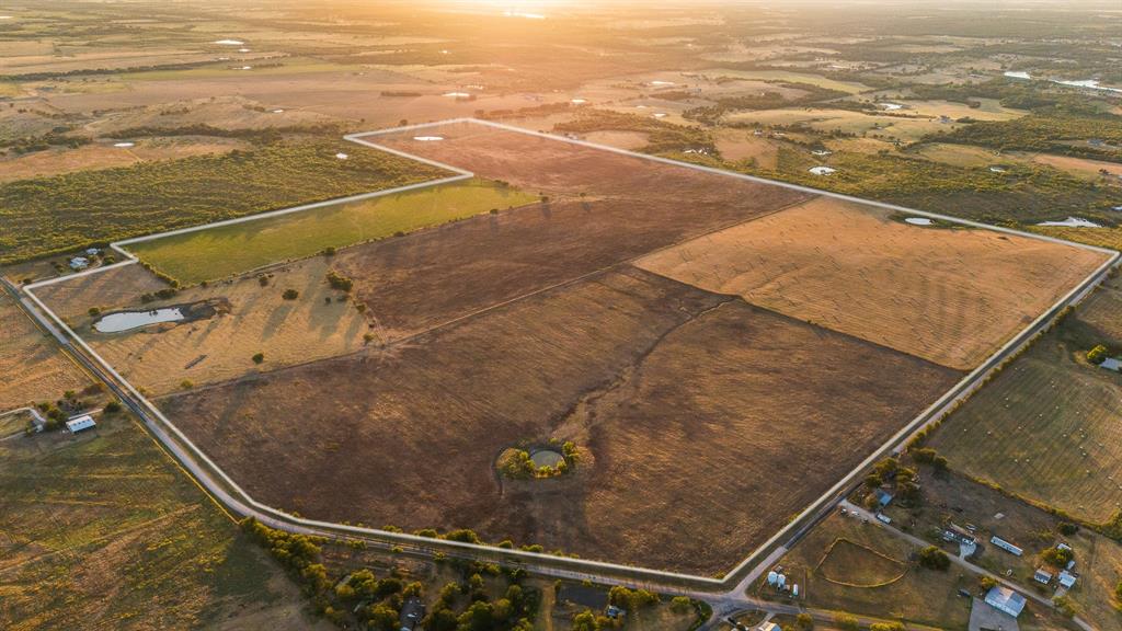 PUT YOUR BRAND ON THIS BEAUTIFUL TEXAS LAND! With OVER 6,600 feet of road frontage, the possibilities for this incredible 348.45 acre property are ENDLESS! The sky's the limit with the development potential from water accessibility to the perfect tract layout this is a civil engineer’s dream project. Nestled in the heart of a picturesque countryside this sprawling property offers acres and acres of fertile farmland with nutrient rich soil and 4 great-sized ponds for your livestock. With cross fencing already in place it’s turn-key for your choice of ranch management. There is currently two water meters on the property as well as electric accessibility from any of the road frontage. The location of this property is PRIME! You are within 10 miles to I35, Highway 6 and all that Waco has to offer while also being within the wonderful school district and community of Axtell. This is a rare opportunity in Waco. Come see all this ranch has to offer, TODAY!