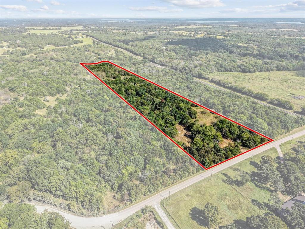 Qualifies for a 5% down financing program for buyers who meet the lender’s eligibility criteria. Located just west of FM 901 on Gilbreath Road, this 11-acre tract offers the perfect blend of privacy, natural beauty, and convenience. Mature trees blanket the property, creating a secluded setting that feels much larger than it is. Enjoy abundant wildlife and peaceful creek views with over 325 feet of Sandy Creek frontage—ideal for nature lovers, hunters, or anyone seeking a quiet country retreat.  A new culvert and driveway are currently being added for easy access. Electric service is being extended to the property, and a Two-Way Special Utility District water line is available at the road.
Located outside city limits and ag exempt, this property offers low taxes and excellent potential. Whether you’re looking for a weekend getaway, recreational property, or the perfect place to build your dream home, this tract delivers it all. Additional acreage available!