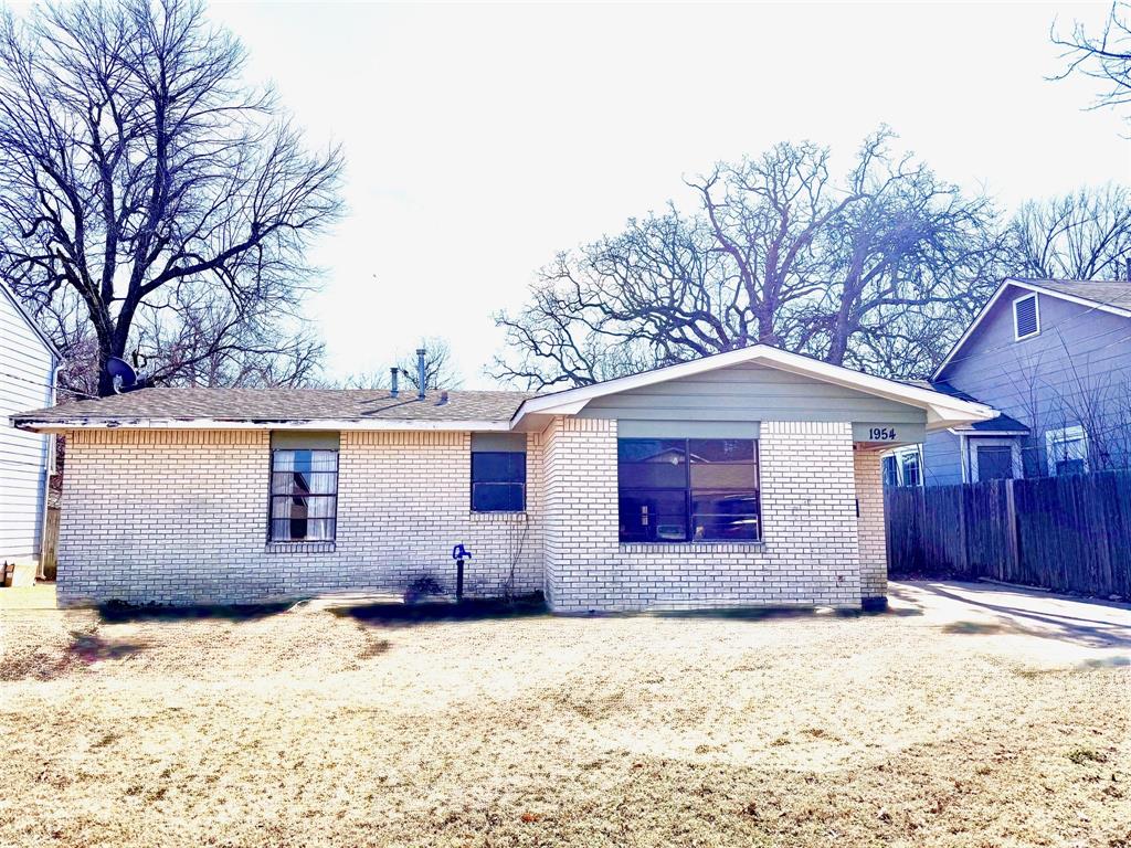 Solid brick-veneer home offering 3 bedrooms, 1 bathroom, and 2 living areas. Gas log fireplace in cozy den, functional kitchen layout with stove and refrigerator conveying to new owner and ample space for everyday living or future updates. Exterior features a fenced backyard, providing privacy and room for outdoor activities. Ideal property for investors or buyers seeking a home with strong potential.