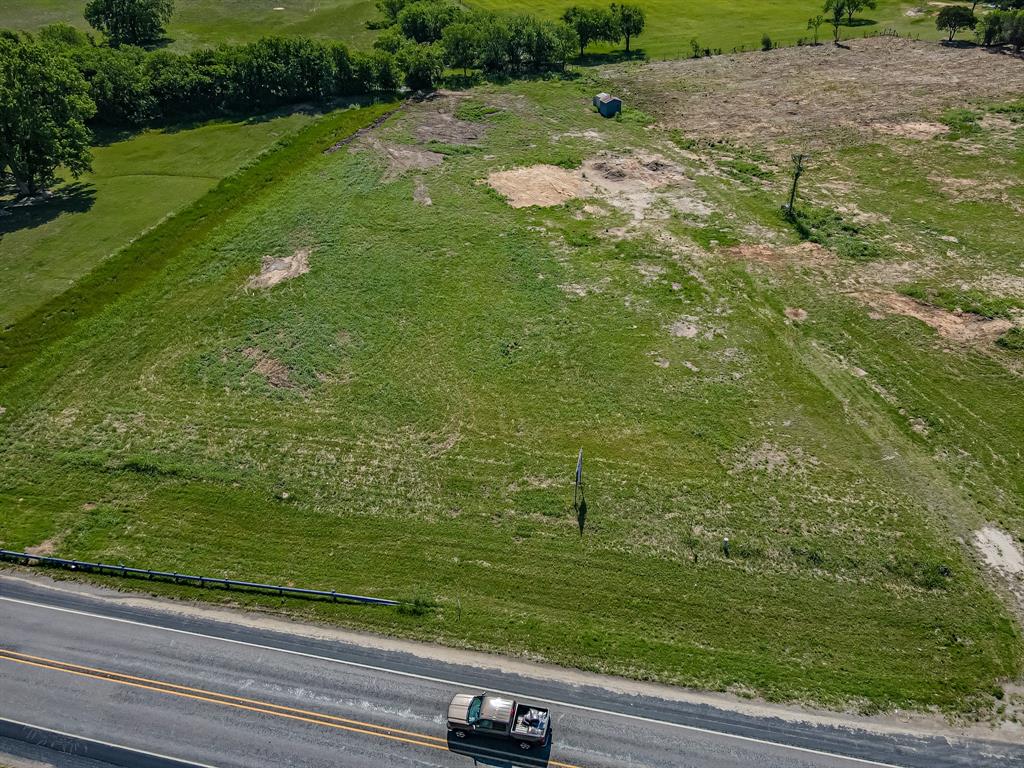 Zoned Heavy Commercial - This lot fronts on the Weatherford Hwy (Houston Street) & Tucker Way. City water, Co-op electric, septic required. Convenient location with great visibility and access. This lot is adjacent to a large Pickleball facility. Common area maintenance agreement for Lots 1-4. Call Listing Agent for more details.