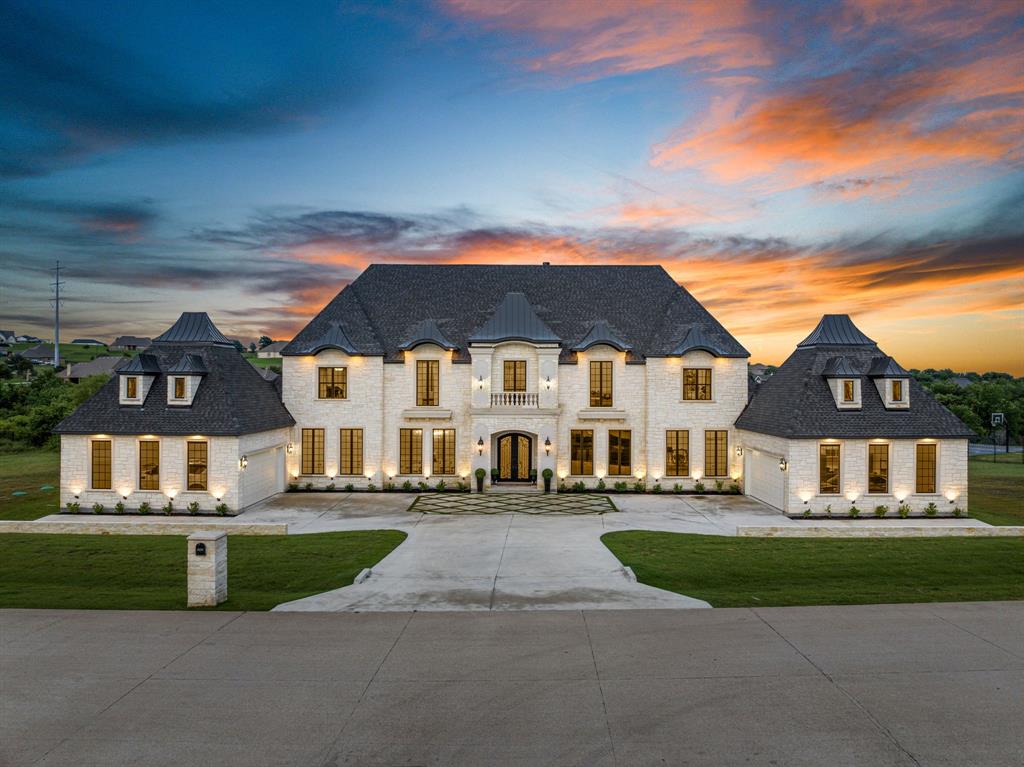 Nestled within the prestigious gated community of Bella Flora, this magnificent estate offers unparalleled luxury on nearly 2ac. Located in highly sought-after Aledo ISD, this property boasts an exceptional design, adorned with exquisite custom lighting and paneling. Step into the heart of the home and discover a chef's dream kitchen, complete with double ovens, a walk-in pantry, and breathtaking views of the creek. Unwind in the stunning study, featuring rich wood beams, a cozy fireplace, and an entertainment area perfect for relaxing after a long day. Retreat to the master suite, where his and her custom closets provide ample storage space and a walk-thru shower. With ample room for a future pool, sports court, and guest house, this outdoor space invites endless opportunities. With every detail meticulously crafted to perfection, this home epitomizes the essence of luxury living, offering an unparalleled blend of comfort, elegance, and sophistication that is simply unrivaled.