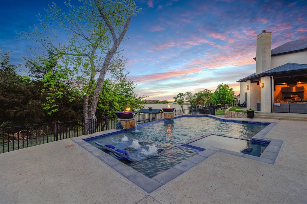 ENTERTAINER’S DREAM LAKEFRONT HOME!!!

This stunning 5,000+ sq. ft. lakefront estate in Heath Golf & Yacht Club is designed for luxury living and ultimate entertainment! Featuring 4 bedrooms (2 downstairs), including a mother-in-law suite with a private garage and separate entrance, this home is perfect for multi-generational living.  

Enjoy breathtaking lake views from the expansive glass doors leading to the heated pool, outdoor kitchen, fire pit, and in-ground trampoline. A private boat dock with jet ski & boat lifts and a unique multi-layered backyard make lakeside living effortless.  

Inside, you'll find Carrera marble countertops, travertine floors, a wet bar with wine storage, a spacious office, and a top-of-the-line media room. The 7-car temperature-controlled garage includes RV storage and an 80 lb air compressor with air stations for pool floats or tires. A lake pump helps irrigate the lush landscaping.  

Located in a resort-style community with 8 pickleball courts, tennis courts, a fitness center, private golf, a clubhouse with a full-service restaurant, a resort pool, onsite massage therapy, locker rooms, and yoga. All within the highly-rated Rockwall ISD and just 20 miles from Downtown Dallas.

This is lake living at its finest! Don’t miss this rare opportunity! ?????