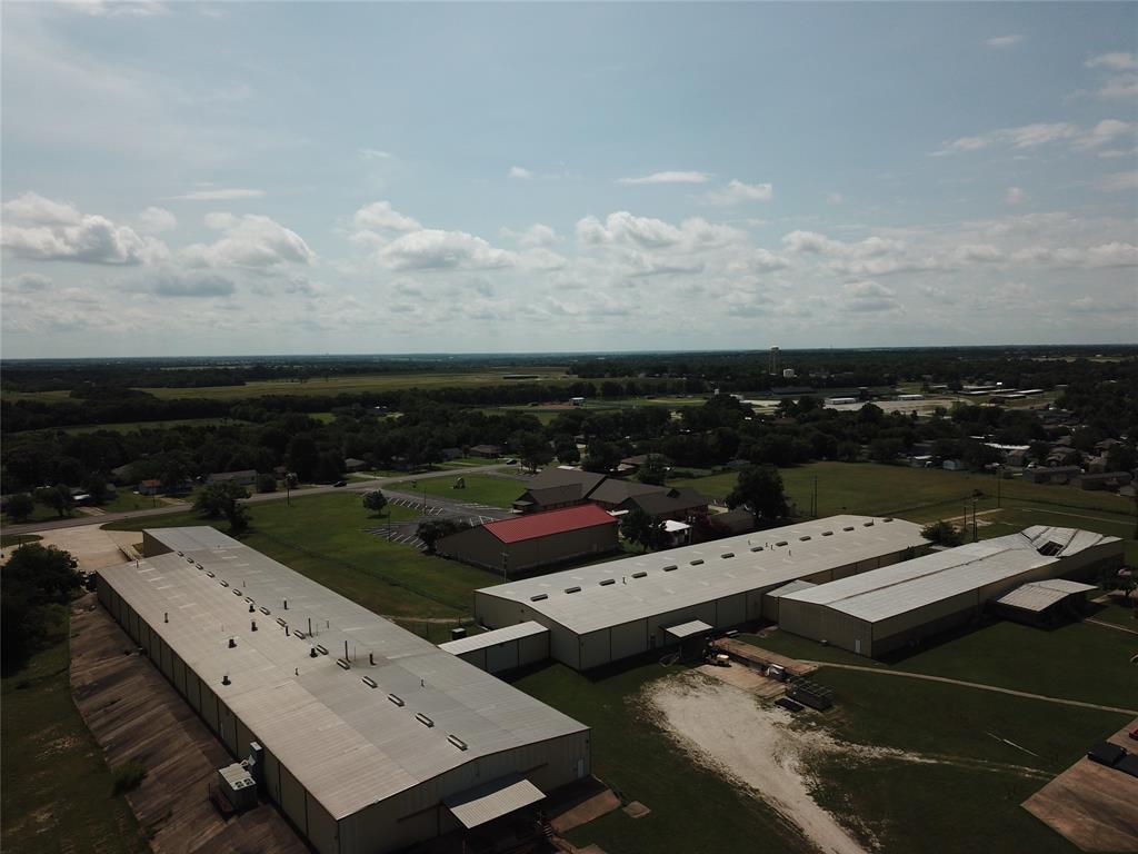 Building  is 95,000 sf of which 40,000 sf is Midwest Powder Coat designed and built line - 1000 ft powder coat line  consisting of 5 stage washer, large environmental room, recent environmental room, large air unit purchase, burn off oven and all hooks and racks. The remaining portion of building is fabrication and office space. 
The building has access off Hwy 75 and Hwy 5, 2 docks off Hwy 75, and 2docks off Hwy 5, in addition there is 1 overhead drive in door off Hwy 5. 
Building has City of Howe utilities, 480 electrical service and ample paved parking. Property has fenced outside storage with plenty of room to accommodate additional IOS if need. The building is designed so the powder coating operations could be purchased independently from office and fabrication activities.
The property has aprox 1160 ft of frontage on Hwy 75 and aprox 208 frontage on Hwy 5, all situated one exit south of the TI complex, aprox 1.25 
miles. Owner will consider financing with  acceptable downpayment and terms.

PROPERTY AND BUILDING CAN BE SUBDIVIDED: Powder Coat Line, approximately 40,000 sf bldg, and all contents, 2 docks on HWY 75, 2 docks and Overhead drive in Door on HWY 5  $6,985,000 including approximately 3 acres of land. NORTH SIDE OF SURVEY.

Fabricating and office, approximately 50,000 sf facility, access to HWY 75, 2 docks on HWY 75 side and 2 docks on south side of bldg, 480 electrical service, water, sewer and restrooms, Coity of Howe.     $6,870,000  CENTER OF SURVEY