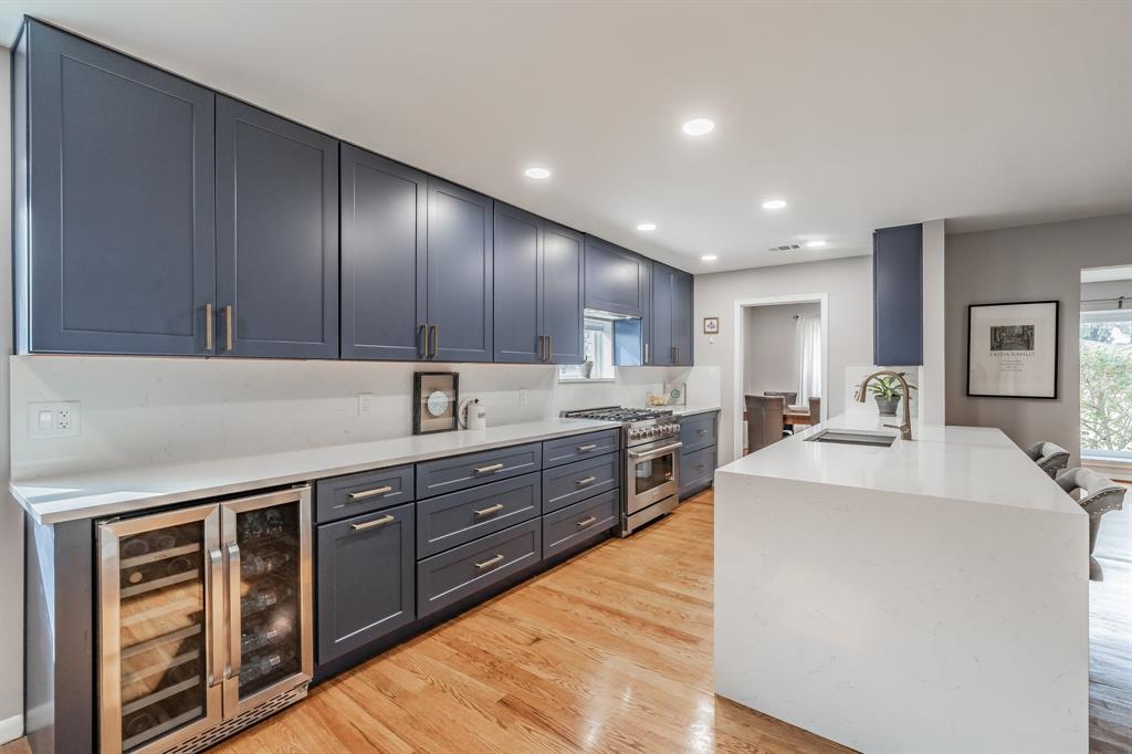 Beautifully updated one-story home featuring an open floor plan in a well-established, mature neighborhood. The stunning kitchen offers real wood cabinetry with pull-out drawers and built-in spice rack, luxury quartz countertops, designer backsplash, stainless steel appliances, and a large waterfall island overlooking the spacious living area—perfect for everyday living and entertaining.
All bathrooms have been thoughtfully updated with designer tile and stylish vanities topped with quartz countertops. The primary suite includes a relaxing soaking tub. Hardwood flooring flows throughout the home, providing durability and easy maintenance.
Enjoy a generous backyard with a massive covered patio ideal for outdoor gatherings. Conveniently located within walking distance to the elementary school, parks, track, and recreation center. Close proximity to White Rock Lake and the Arboretum. This home offers comfort, style, and an exceptional location—welcome home!
