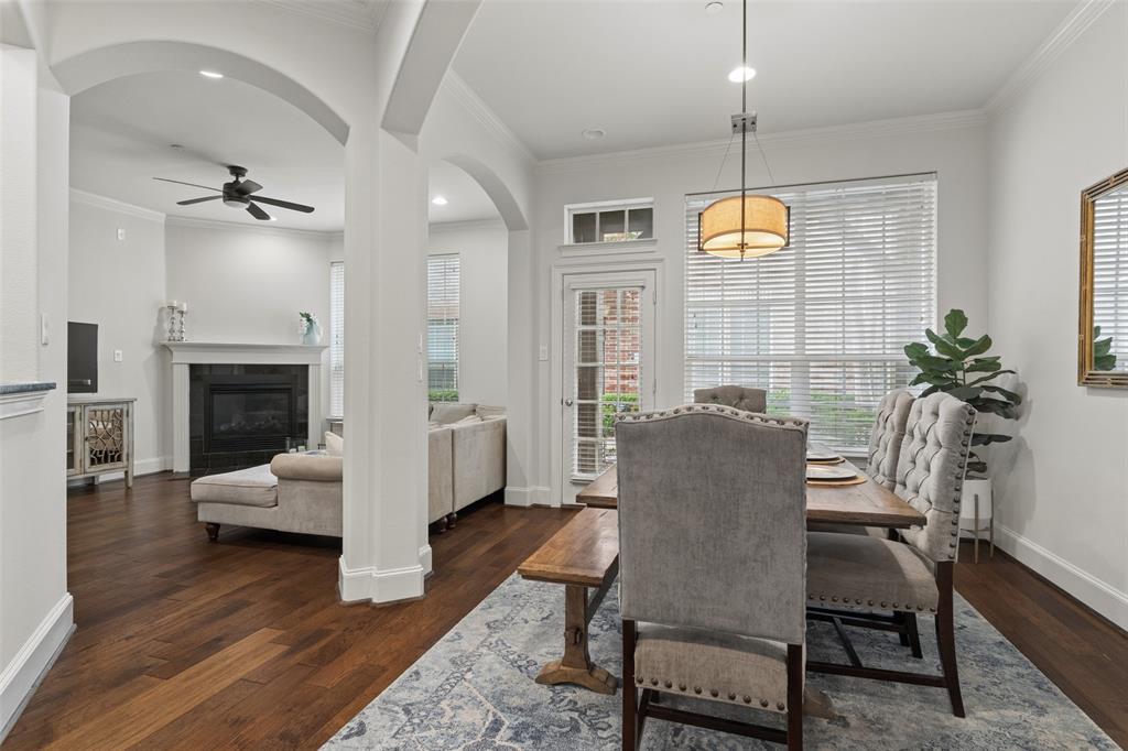 Nestled in a quiet, tucked-away community with unparalleled access to the city, this beautifully maintained condo offers the perfect blend of peaceful living and urban lifestyle—just moments from the charm, dining, and boutique shopping of Lakewood. Step inside to discover an inviting open-concept floor plan filled with natural light, soaring ceilings, elegant archways, and timeless finishes throughout. Rich wood flooring installed in 2015 flows through the main living areas downstairs. The spacious kitchen features abundant cabinetry, granite countertops, stainless steel appliances, a gas range, oversized island, pantry, and extensive prep space. The living room offers a cozy fireplace and expansive windows that bring in beautiful natural light, while the adjacent dining area provides the perfect setting for everyday living or hosting guests. Freshly painted interiors (May 2026) create a bright, modern backdrop complemented by brand new carpet (May 2026). Upstairs, the oversized primary suite serves as a true retreat with generous proportions, plush new carpet, and a spacious ensuite bath complete with dual vanities, soaking tub, separate shower, and large walk-in closet. A versatile third bedroom addition completed in 2023 provides added flexibility for guests, a home office, nursery, or workout space. Additional highlights include a dedicated upstairs flex area, spacious secondary bedrooms, and abundant storage throughout. Thoughtful seller updates include a new HVAC system installed in 2023 with annual tune-ups through Milestone Advantage membership since 2025, upgraded disposal, and oven and microwave both replaced within the last five years. Overhead garage storage will also convey to the buyer for added convenience. Enjoy beautifully maintained community grounds with mature landscaping, tranquil walkways, and an unbeatable Dallas location offering quick access to Downtown, Uptown, White Rock Lake, Greenville Avenue, and major thoroughfares!