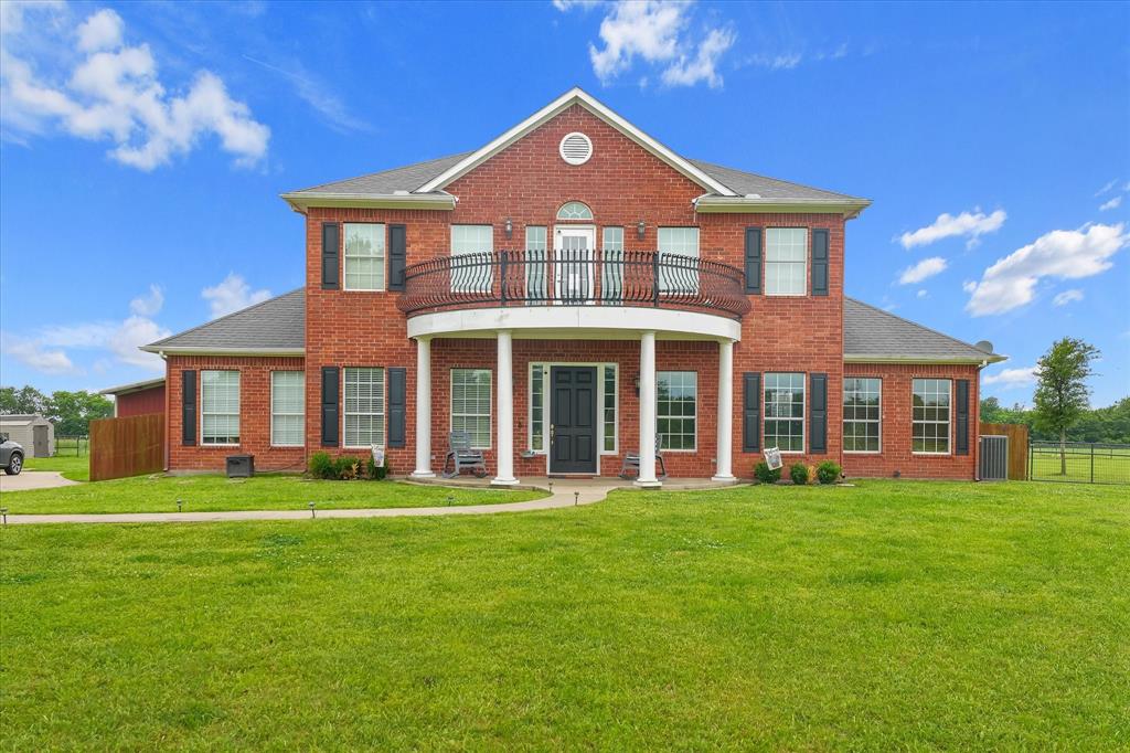 Nestled on 5+ scenic acres in Redbud Estates, this beautiful 4-bedroom, 3.5-bath custom home offers the perfect blend of peaceful country living and everyday comfort. With 3,450 sq ft, this traditional two-story home features spacious living areas, a private office, and a thoughtfully designed layout ideal for both relaxing and entertaining. The large open kitchen is equipped with granite countertops, a large island, built-in cabinetry, and ample space for gathering, flowing seamlessly into the living and dining areas. The primary suite on the main level is a true retreat featuring a sitting area, jetted tub, dual sinks, a custom walk-in closet, and a built-in safe room for added security and peace of mind. Upstairs, generously sized secondary bedrooms offer walk-in closets and plenty of space for family or guests. Enjoy outdoor living with a covered patio, balcony, and expansive private yard, perfect for taking in the wide-open Texas views. Designed for versatility, the property is horse-friendly and includes a workshop with electricity, RV hookups, and additional storage buildings—ideal for hobbyists, outdoor enthusiasts, or those seeking space to spread out. Located outside city limits with easy access to McKinney, this property delivers the space, privacy, and flexibility you’ve been looking for—without sacrificing convenience.