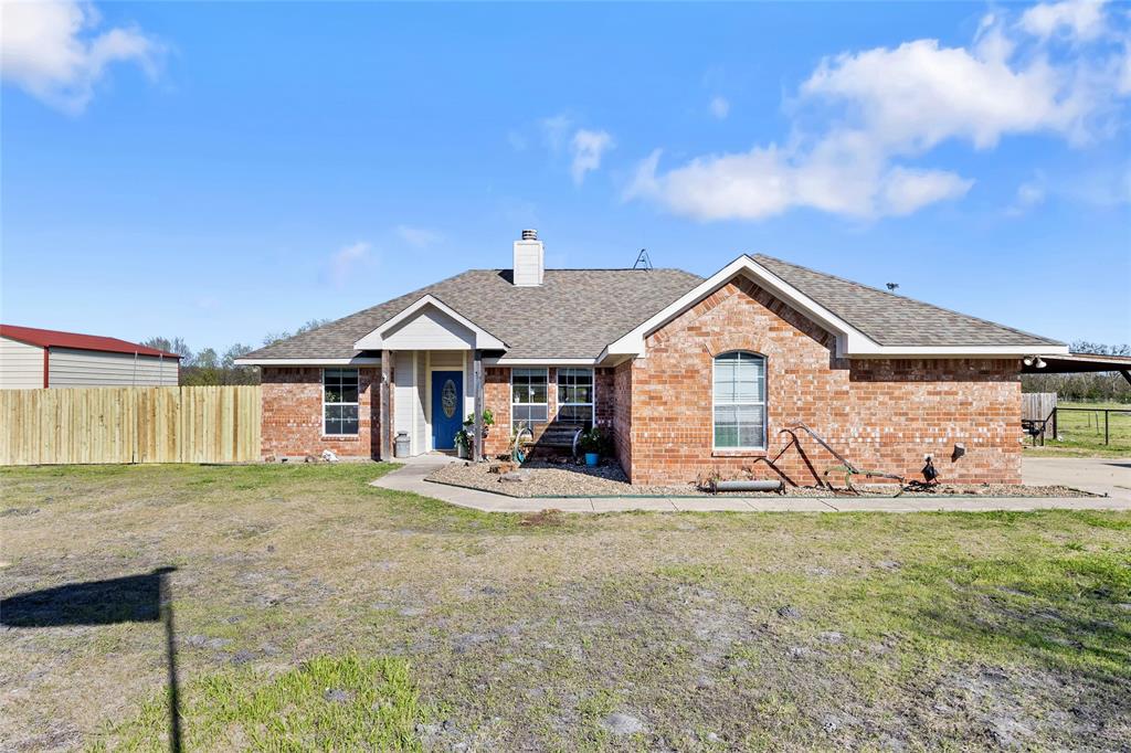 Experience the perfect blend of country charm and modern comfort in this beautifully designed 3 bedroom, 2 bathroom home situated on 1.5 fenced acres in Bland ISD. Featuring a desirable farmhouse feel, this home offers luxury vinyl flooring throughout with NO carpet, a stunning decorative fireplace, and a functional split floorplan designed for both privacy and everyday living. Step outside to enjoy the wonderful covered back patio overlooking the ultimate backyard oasis, complete with a recently built swimming pool that creates the perfect setting for relaxing or entertaining. The property also features a 25x30 shop. The barn, currently used as an indoor dog kennel, fully equipped with electricity, water, and a mini-split HVAC system, offering endless possibilities for hobbies, business use, or additional workspace. Additional highlights include a 30-amp RV plug in the garage and a convenient location just minutes from Hwy 380, shopping, and restaurants. Enjoy peaceful country living without sacrificing convenience in this exceptional property.