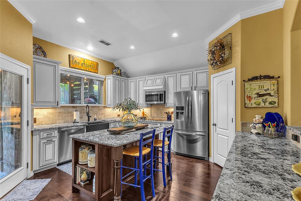 Bring your best offer to 4512 Seventeen Lakes Ct in Roanoke Tx. It is ready for its second owner. $5k credit towards buyer incentives.  The home lives large with an open-concept main living area connected to the designer kitchen, a secondary living or game room that offers flexible space for media or play, the 4th bedroom is a dedicated front-of-house study that is ideal for working from home, homework, or a quiet retreat.  The kitchen was renovated in 2019 and features high-end, soft-close, dovetail-constructed custom cabinets that blend style and durability, creating a polished, upscale feel at the heart of the home.  The primary bathroom has been renovated within the last two years, adding a fresh, modern touch to the private owner’s suite and enhancing everyday comfort.  Additional thoughtful upgrades include an emergency water shutoff manifold in the garage that allows you to shut off water to specific rooms or locations, an automatic sprinkler system for easy lawn care, radiant barrier decking and ridge vents for improved heating and cooling efficiency, and 7.2 surround-sound wiring in the family room for an immersive media experience.  Outside, the home truly shines with a luxuriously updated and meticulously landscaped backyard, where layered flower beds, thoughtfully placed shrubs, and mature plantings frame multiple seating areas to create a private, resort-style retreat.  A tranquil koi pond serves as the focal point of the outdoor space, adding soothing water sounds and visual interest, and pairing beautifully with the hardscape to make the yard feel like an outdoor living room that is perfect for entertaining, relaxing, or enjoying quiet evenings at home.  Located in Seventeen Lakes, residents enjoy access to community lakes, walking trails, and green spaces, along with convenient routes to nearby employment hubs and amenities, making this home a compelling option for buyers seeking both comfort and lifestyle in Roanoke.