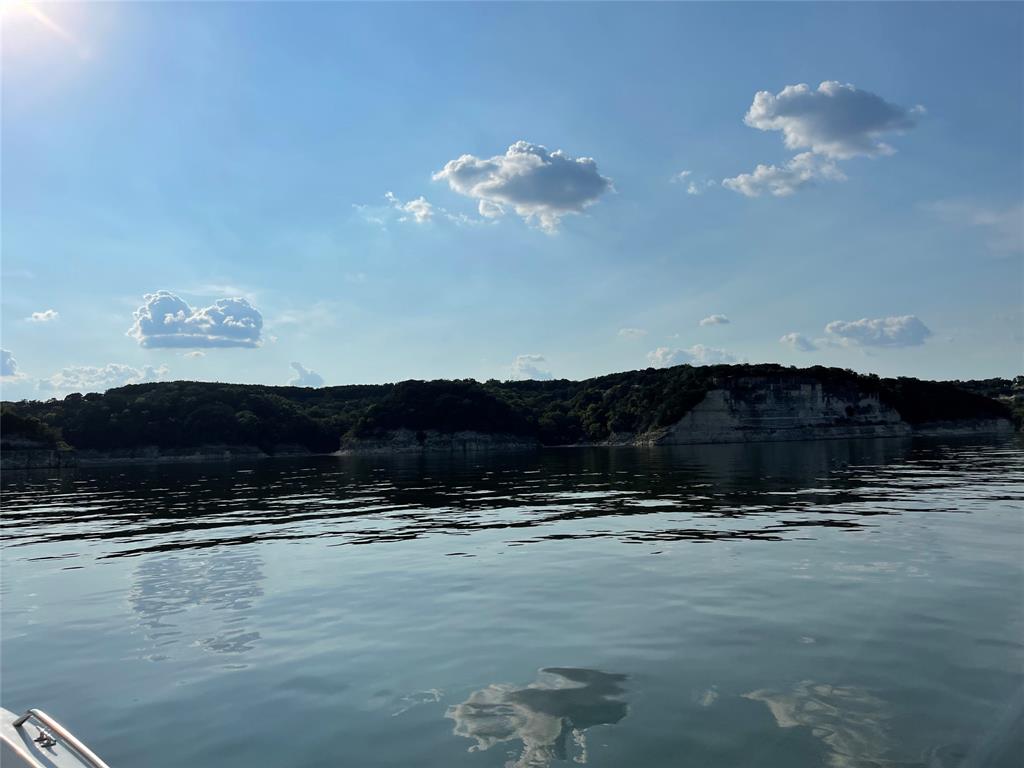 MOTIVATED SELLERS --- Build your dream home in this gated, resort-style community with stunning lake views! This prime lot offers more than just a homesite—it’s your entry into a safe, welcoming, and tight-knit neighborhood with paved roads and resort-style living. Enjoy clear views of the water (not on Bluff Side) and be just minutes from top amenities including the spa, playground, pool, marina, and restaurant. Whether you’re searching for a full-time residence or a weekend retreat, this blank canvas is ready for your vision. Don’t miss this opportunity!