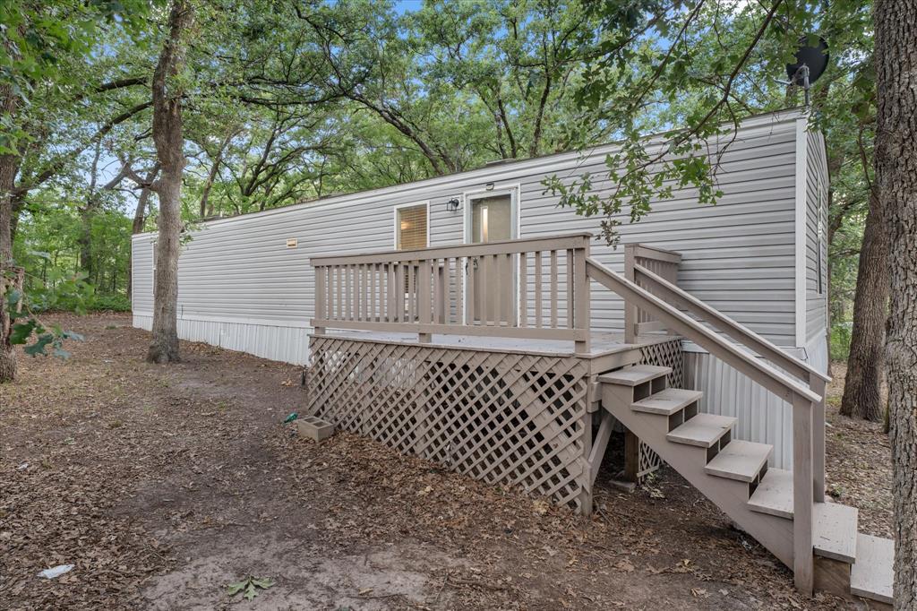 NICE SINGLEWIDE ON 2 LOTS IN GREAT CONDITION. BUILT IN 2015 THIS 2 BEDROOM 1 BATH SITS ACROSS THE STREET FROM THE LAKE. HAS OPEN DESIGN, NICE DECK ON FRONT, WATERFRONT AREA WITH BOAT LAUNCH. GREAT LAKE RENTAL!!! SELLER WILL CONSIDER OWNER FINANCING WITH 20% DOWN. YOU CAN BUY CHEAPER THAN RENTING.