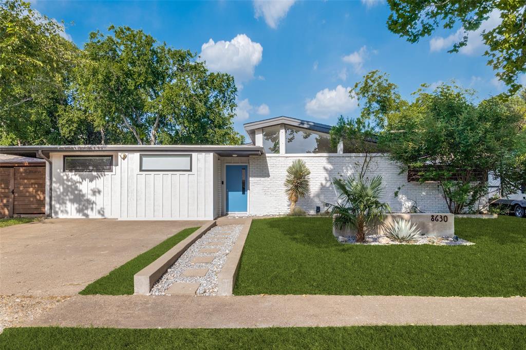 Discover the perfect blend of timeless Mid-Century Modern design and contemporary living in this beautifully updated 4-bedroom, 3-bath residence. Originally built in 1955, this home has been thoughtfully renovated to preserve its iconic clean lines while offering today’s most desirable amenities. The spacious primary suite features a walk-in closet, soaking tub, separate shower, and a private retreat feel. The remodeled kitchen is equipped with travertine-look quartz countertops, an oversized island, gas cooktop, and a vintage-style exhaust hood that complements the home’s character. Hardwood floors flow throughout the home, while remodeled bathrooms, Low-E replacement windows, fresh interior and exterior paint, and numerous modern updates provide comfort and efficiency. Multiple patios create inviting spaces for entertaining and seamless indoor-outdoor living. The beautifully updated landscaping enhances the home’s curb appeal, while the turfed backyard with a putting green offers a low-maintenance outdoor oasis. A detached back house with a full bath provides exceptional flexibility as a guest suite, home office, gym, or studio. Additional improvements include an oversized covered 20x24 rear-entry carport, roof replaced in 2020, and a newer HVAC system. Located within Richardson ISD and nestled in one of Dallas’ most celebrated Mid-Century Modern neighborhoods, this home offers a rare opportunity to own an architectural gem with style, function, and versatility.