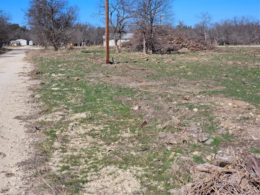 Over 2 acres, homesite, water meter on property. Electricity available at property. Scattered trees. Flat corner lot recently cleared.