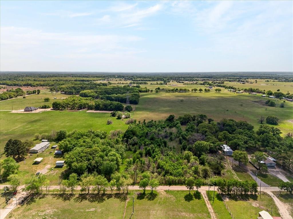 Less than one hour to Dallas but a world away. This 2 plus acre lot has plenty of trees and natural beauty and it can be the country living dream that you have been waiting for. The fact that this property is only minutes away from Cedar Creek lake only makes it that much enticing. Wake up in the mornings and decide if you want to enjoy your land, go to Dallas or spend the day at the lake.  The peace, quiet, serenity and the security of your own land are more important than ever so come on out and take a look.