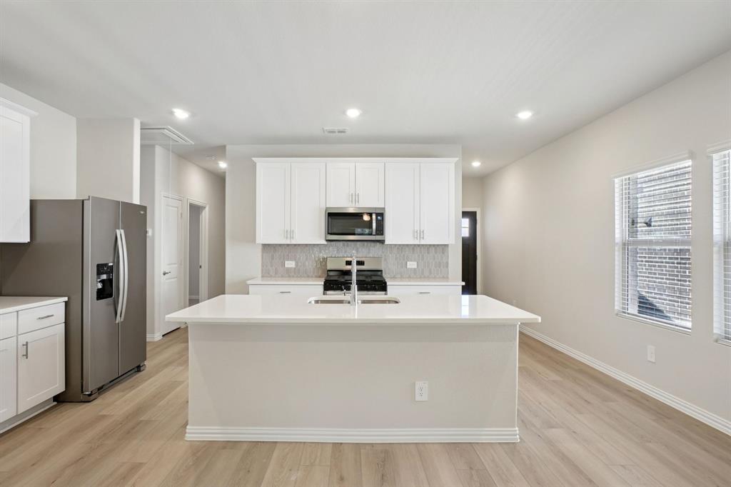 BRAND NEW energy - efficient home Jun 2026! Enjoy family dinners around the kitchen island in the Sequoia's convenient eat-in kitchen. Pebble cabinets with marble-look white granite countertops, beige tone EVP flooring and multi-tone grey carpet. Spend the weekends debating what activity to do in this amenity-filled community, make a splash in the resort-style pool, pick up a game of basketball, or let the kids loose on the playground. With quick access to US 380, residents will enjoy the benefits of a short commute to downtown McKinney, Frisco, or Richardson to enjoy nearby shopping and entertainment. Each of our homes is built with innovative, energy-efficient features designed to help you enjoy more savings, better health, real comfort and peace of mind