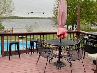 Just in time for the SUMMER!!! This Lake cabin sitting on 1.05 acres of LAKE FRONT, overlooking Lake Bonham on the point of the peninsula. Right around the corner of Lake Bonham Park. Has 3 docks, one with a boat slip. Fire pit to gather around on those cool nights. Above Ground pool, A 2 tier deck on the back of the house to sit and view the Lake and watch the fireworks on July 4th. This 2 bedroom 2 bath Lake cabin will be your get away to relax and enjoy outdoor living. Cabin is wired for generator, kitchen plumbed for propane, built in 2001, storage building, under deck storage, has a 2004 RV that can stay with property, was used for guest quarters or extra living space. In storms stay safe in the storm shelter on premises. Lake Bonham is a fantastic recreational lake with a sandy bottom. This little piece of Heaven can be yours to enjoy. Come out and take a look at these views.