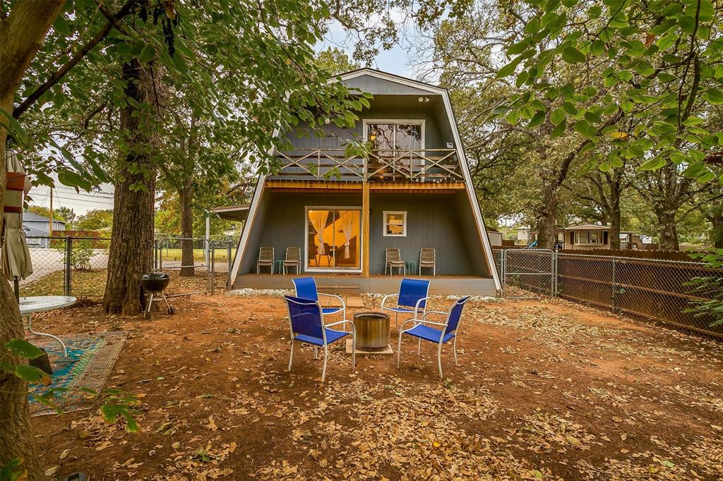 This idyllic waterfront A-frame property in Port Ridglea East is ready for its new owner. Luxury vinyl plank flooring in living room and bedrooms in 2022, new water heater in 2023, thermal-wrapped crawl space for humidity control in 2023, and back deck redone in 2022. The carport was also recently redone. The neighborhood includes a pool, cabana, and sport courts for homeowners and guests to enjoy. This property does not currently have a dock, but one could be easily added. Only 15 minutes from the historic Granbury Square, this home has quick access to all of the shopping, dining, and entertainment you could ask for. This is the perfect place to get away and escape the hustle and bustle of the life for some peace and quiet. Come see all that this home has to offer today! Sellers are willing to consider up to a $5,000 concession towards closing costs or rate buy-down with full price offer.