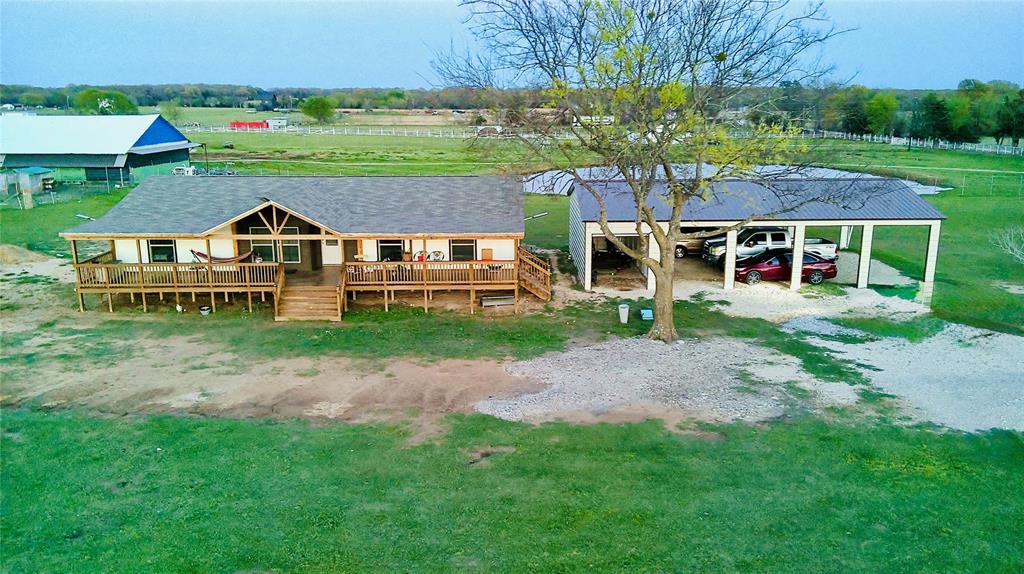 Are you looking for a Ranch Life but do not want the hassle? This property is MOVE IN READY for YOU! Featuring a 2025 Doublewide home with 4 bedrooms and 2 bathrooms on over 5 fully fenced acres with no unknown restrictions, this property offers the freedom, space, and flexibility buyers are searching for. All the hard work has already been done, making this an easy transition for its next owner. Enjoy a front electric gate for added privacy and security, convenient access to Highway 20, and peaceful country living with close proximity to city amenities. This property also includes a new septic installed in 2025, a spacious 30 X 50 carport that accommodates 4 cars. A major BONUS is the partially completed 30 X 50 bardominium with pier and beam foundation already in place, offering the opportunity to finish out as a second home, guest house, or income producing rental. Ideal for multi-generational living, investment potential, or buyers needing space for animals, equipment or business use. NO HOA and no known restrictions bring your ideas and make it your own. This home is ready for a new owner-Schedule your showing TODAY!