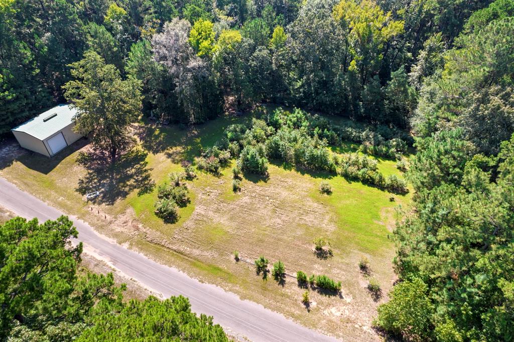 Fisher’s paradise near beautiful Simpson Lake! This unique property is a one-of-a-kind opportunity to build the spectacular home you’ve been dreaming of! Towering, majestic trees offer a stunning backdrop and allow for added privacy to create the perfect, luxurious retreat. Amenities abound including easy boat ramp access to the pristine lake waters with renowned fishing, a spacious 1200 square foot shop perfect for storing your boats and gear, and even an exclusive helipad for quick come and go access. As if you needed more incentives, this exceptional property boasts a large, personal blueberry farm and a fresh, sweet water well. Don’t miss out! Schedule a tour today and start building your dreams tomorrow!
