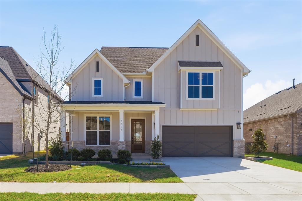 PROSPER ISD – The Burnet Plan features a stunning Farmhouse Modern exterior with a welcoming front porch. Inside, you’ll find an elegant curved staircase, a modern central fireplace, and soaring ceilings in the family room. The chef’s kitchen boasts a large island, painted cabinetry, and white quartz countertops. The primary suite includes a freestanding tub, a spacious shower with a frameless glass enclosure, and his-and-hers closets. Light nail-down hardwood floors bring warmth to the main living areas on the first floor, while upstairs offers a media room and a fourth full bath. Enjoy an upgraded technology and lighting package, along with many additional enhancements throughout the home. No MUD or PID tax! Welcome home to our Shaddock family!