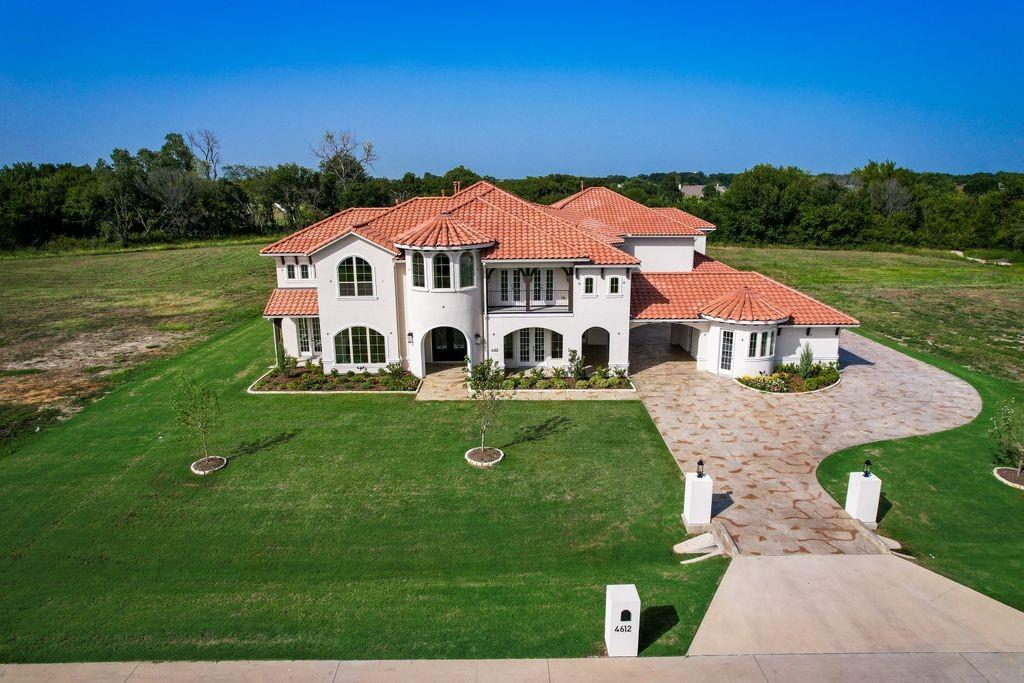 New Grand Home on 2 acre lot with 5 Car Garage!  Enjoy spacious living in this custom home neighborhood with 8600 sqft, 8 bedrooms & 8 livings. Incredible home has tons of amenities & stunning drive up appeal. Double front doors open to double staircase. 30 ft vaulted Great Room w slider doors to large covered back patio w fireplace. Open concept kitchen has a 2nd prep kitchen, double ovens & a butlers pantry. Mud Room. Formal Living has fireplace, library opens to a patio & large office in back has great view. Primary Bedroom has fireplace & slider doors to back patio. Formal Dining & Wine Cellar. 3 bedrooms downstairs. 2nd Primary upstairs has a private living & patio. Huge gameroom has large covered balcony overlook back. Media Room with snack bar. 2nd back staircase. Reading Loft. Too many features to list. Must See! Energy Star certified home with R38 & radiant barrier roof. Gorgeous home on 2 acre homesite very rare on the market.