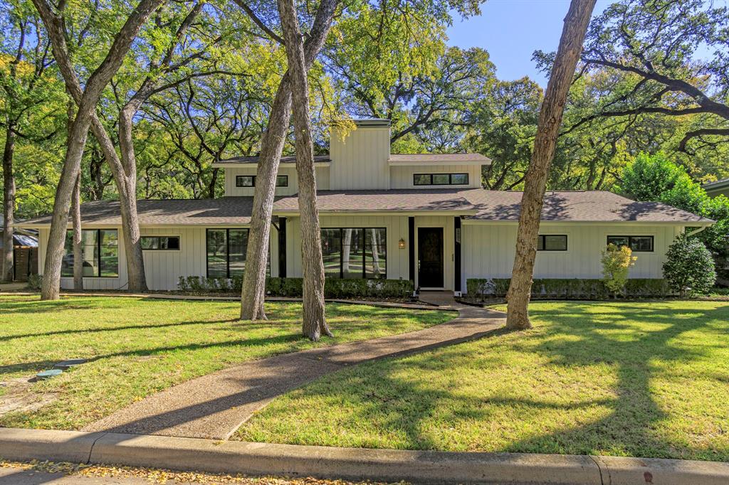 Nestled in the sought-after Mockingbird Addition TANGLEWOOD, this Traditional-style residence offers a plethora of features and qualities that cater to the desires of today's homebuyers. Elegantly designed with a welcoming floorplan, it boasts newer electric, plumbing, windows, roof, and a charming board and batten exterior, all expertly executed with top-notch workmanship. This is an absolute must-see property! The spacious backyard is a haven for entertaining, and the additional advantage of a recently constructed detached 2-car garage in the rear adds to the allure. Furthermore, this home backs up to a tranquil greenspace, ensuring ample privacy and a serene ambiance.