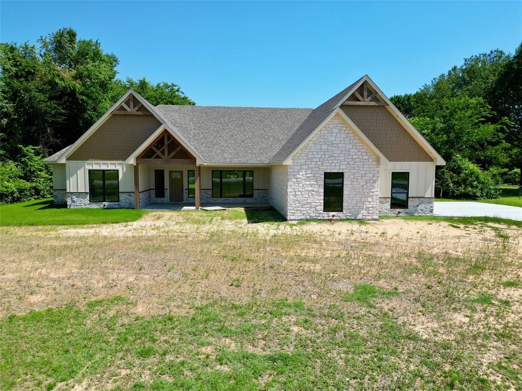 Welcome to this beautifully designed 4-bedroom, 3.5-bath home situated on FM 195 just minutes from the loop and nestled on nearly an acre.   Offering the perfect blend of comfort, style and functionality, this desirable split floor plan provides privacy and space for the entire family.  Step inside to the stunning stained concrete floors and open concept layout filled with natural light. The gourmet kitchen is a true centerpiece with elegant quartz countertops and  white oak custom cabinetry.    The oversized walk-in pantry is a standout feature of this home, offering abundant storage.  This space provides the perfect setup for organization, small appliances, and entertaining essentials while adding a luxurious touch to everyday living.

The thoughtfully designed primary suite and en suite bath features dual vanities a step in wet room that is equipped with a garden tub and a rain head shower with sprayer combo.  The oversized, walk-in closet also doubles as a concrete safe room.  This space offers both luxury and peace of mind.  The generously sized secondary bedrooms offer ample storage throughout, with an additional bedroom and en suite bath. 
Enjoy the outdoor living area with this 24x16 covered patio overlooking a beautiful private lot. Designed with entertaining in mind, the patio is already plumbed with propane gas for a future outdoor kitchen, making it easy to create the backyard retreat you’ve always envisioned. Whether hosting gatherings, grilling with friends, or relaxing with peaceful country views, this property is ideal for both everyday living and hosting guest. 
Built with quality and durability in mind, the home also includes  26 piers placed beneath the entire slab for exceptional structural support, along with additional beams underneath the safe room.