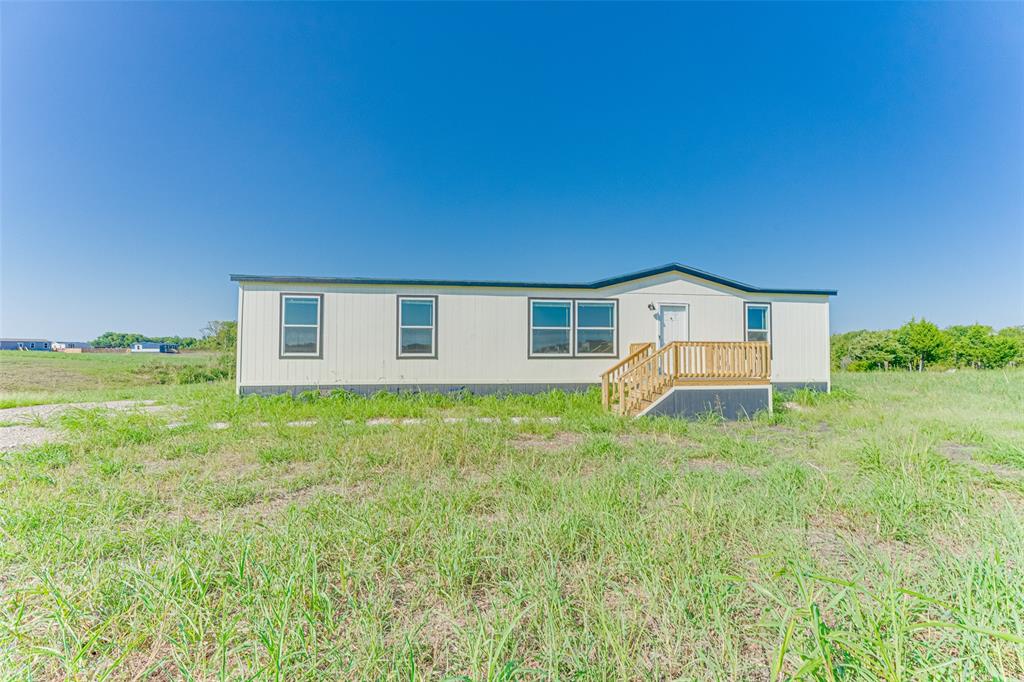 Discover country living at its best in this brand-new Champion home situated on over 3 acres! Located outside the city limits with low taxes, this property offers the perfect blend of space, comfort, and freedom. Inside, you'll find four spacious bedrooms and two full baths, designated for both functionality and relaxation. The heart of the home is the open-concept kitchen featuring abundant cabinet space, a large island, and plenty of room for gathering and entertaining. Step outside and bring your animals to enjoy the wide-open acreage-ideal for creating the lifestyle you've been dreaming of. Whether you're looking for peace and privacy or space to spread out, this property has it all.


See offer guidelines - Contact agent regarding title company
14 disclosures for mobile homes that must be signed and submitted with offer.