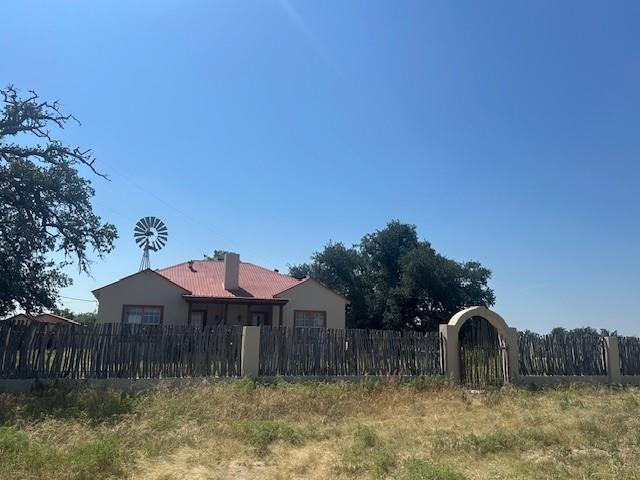 LAND: This beautiful ranch is irregular in shape with paved road frontage on RM 864 and RM 2597. It offers a variety of elevation changes with good draws, native pastureland, and scattered live oaks, juniper and mesquite trees and is separated into several pastures with ample water supply for grazing livestock and wildlife.  

IMPROVEMENTS: Headquarters is 2,016 sq. ft., 2 BD, 1 full BR. This entertaining paradise has a large living room with fireplace, wood floors, and wood carved wall accents. The galley style kitchen has brick floors and opens into the living and dining rooms.  The home is stucco with metal roof and offers a large, fenced front and back yard with cedar stays, and stucco columns. 
A 1 room bunkhouse is in the backyard with a bedroom, shower, sink, cabinetry, and washer & dryer. 
A 1,152 sq. ft. 2 story rock house, completely remodeled, offers 1 large BD upstairs, a full BR, family room and kitchen.
A 4-BR, 1 BR, Jim Walters home with 1,425 sq. ft., open concept living room, dining room, galley kitchen, fireplace, and large utility room. This home offers and large covered front porch and fenced yard.
A 912 sq. ft. mobile home with 3 BD, 2 BA, and covered front porch. 
2 walk in coolers. Large shop with electricity, barn and pipe corrals. 2 water wells.  Excellent fences! 

MINERALS: The owner will convey all minerals owned with the sale of the property and leasing rights.

SUMMARY: This ranch is an ideal property for family and guests to enjoy hunting, recreation, and ranch life in beautiful Sutton County. It offers an easy drive from Sonora, San Antonio, Junction or San Angelo. It offers plenty of lodging and accommodations for large groups year-round who want to get away from the city. Native and exotic game in the area include Whitetail, Axis, & Sika deer, turkey, hogs, dove and quail.  Sutton County has exceptional hunting! Additional acreage is for sale in the area. Contact the listing agent for locations and acreage amounts.