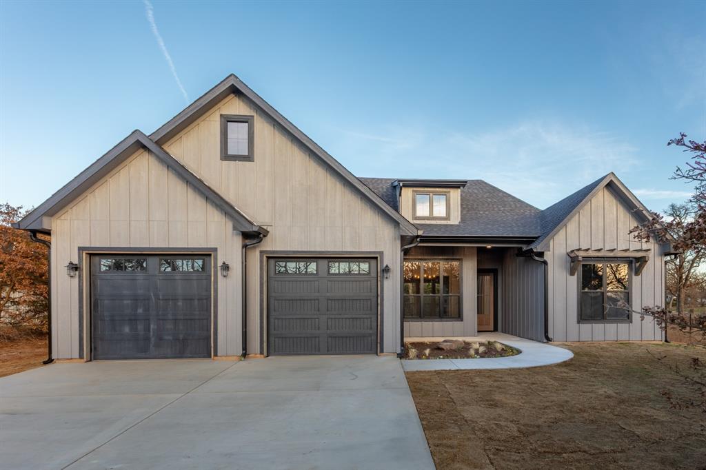Fabulous new construction modern farmhouse home located on a treed 1-acre lot in the quiet and charming area of Cooke County! This home features a 4 BR 3 BA split floor plan with room to roam outdoors! The living room features cathedral ceilings, gas fireplace with antique headboard, and gorgeous views of the back of the property. Kitchen has gas range, quartz countertops, island, an abundance of cabinets, walk-in pantry, apron front farm sink, refrigerator, lots of natural light and is open to the living area! The dining room is also open to the living area and features a dry bar. The stunning primary bedroom and bath features a massive shower with dual shower heads and custom tile work, separate soaking tub, dual vanities, sitting area, extra cabinet and storage space, and an oversized walk-in closet! No shortage of upgrades on this house: Pella windows, tankless hot water heater, luxury vinyl plank and custom tile flooring, tall ceilings, spray foam insulation, 2x6 exterior walls, storage in the garage, and storage closet at the rear exterior. Covered patio is the perfect place to relax and features an outdoor fireplace and is plumbed for gas and water for an outdoor kitchen area. The land is absolutely phenomenal and the perfect place to have a garden, chickens, livestock, horses, homestead, and so much more! No HOA: freedom to make this place yours! The property features mature oak trees and cedar trees and is quiet, serene, and peaceful. Listen to the birds chirp, the crickets sing, and the leaves rustle as you retreat and relax! If you need to get out and shop or need to commute the property is in close proximity to Hwy 82 and Hwy 377, making it easy to get anywhere. Don't miss this fabulous opportunity to live on a beautiful North Texas property in an amazing new home!