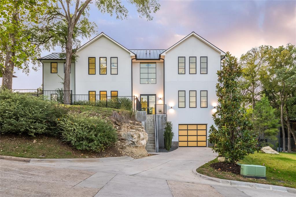 Nestled amongst the trees of sought-after East Kessler Park, the grass is truly greener on Evergreen Hills Road. Lush surroundings and a dynamic landscape encompass this unparalleled sanctuary that stands equipped to serve any lifestyle. Off the oversized 4 car garage, a private downstairs retreat incorporates elevator access, wine closet and safe-room built into the natural terrain. Main living area features enormous kitchen, sleek fireplace, and a home office with views of the pool below. Designed with a highly coveted dual-master suite layout, the remaining secondary bedrooms all have WICs and private bath. Top floor offers panoramic views and would make great fitness studio, second office or kids retreat.