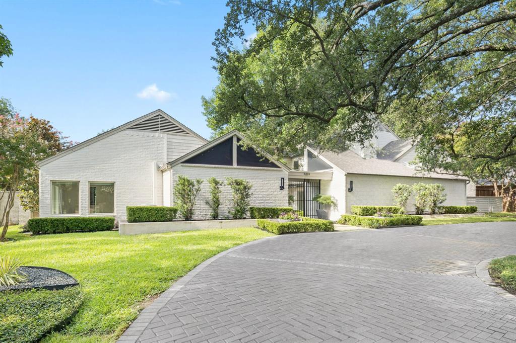 From the gated front courtyard to the lush backyard retreat, this home is a one-of-a-kind masterpiece crafted for everyday luxury and effortless entertaining. Thoughtfully reimagined and impeccably styled, every inch of this residence reflects custom detail and timeless design. Inside are five spacious bedrooms—two downstairs and three up—each offering large walk-in closets and beautifully appointed en-suite baths with unique, high-end finishes. The serene primary suite is a true retreat, featuring separate his and her bathrooms, a cozy sitting area with courtyard views, and generous storage throughout. Vaulted ceilings elevate the living areas, game room, and study, while floor-to-ceiling wide-plank white oak floors create warmth and sophistication. The heart of the home is an extraordinary kitchen with rift-cut white oak double islands, Sub-Zero fridge and freezer, Viking range, JennAir steam oven, plumbed coffee bar, and storage at every turn. The centrally located wet bar includes a Scotsman ice maker, wine fridge, and custom wine storage—perfect for entertaining in style. Lutron electronic shades, tankless water heater, and a 3-car garage add modern convenience. Outside, a private oasis awaits with a sparkling pool, spa, covered patio with outdoor kitchen and turfed side yard—all surrounded by beautifully landscaped grounds. A rare and refined offering in the heart of Northwood Hills.