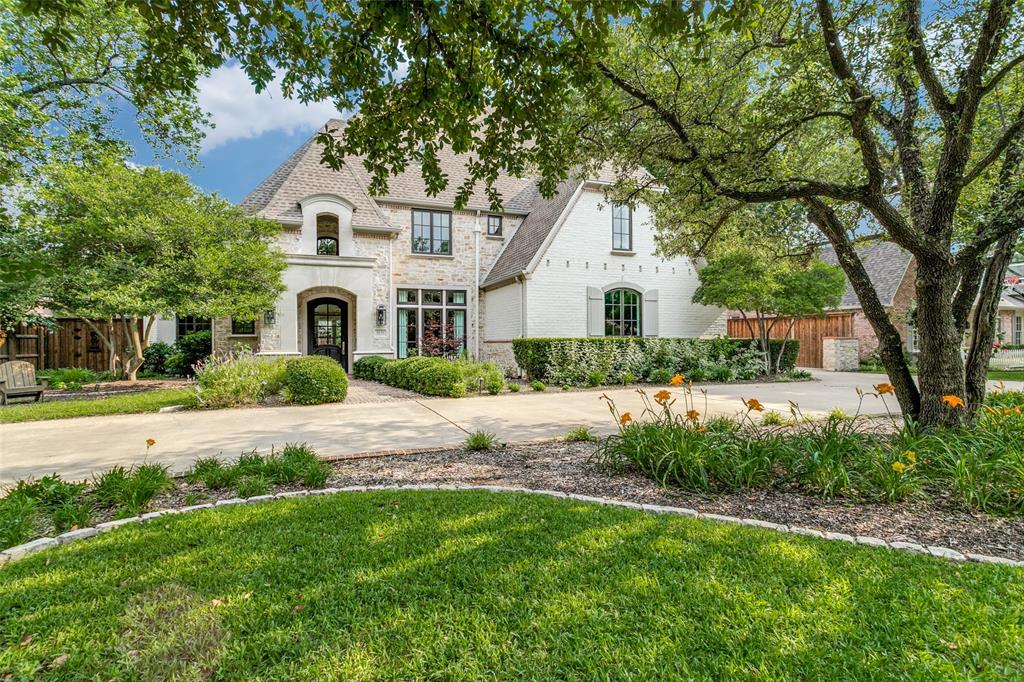 Extensively remodeled in 2020-2021, this home has it all! Refinished hardwoods throughout, high ceilings, Pella windows and doors throughout. Updated kitchen with beautiful cabinetry and top-of-the-line appliances including Subzero refrigeration, a Wolf induction cooktop, additional refrigeration drawers, large center island and wet bar. Office with a private patio and views to the lush landscaping. The living room with fireplace and  French doors, high ceilings, and a fireplace overlooking the tranquil backyard. The primary suite is private with views to the outdoor area and a large walk-in closet. A spa-like bathroom is a showstopper with his and her vanities, gorgeous countertops and a stunning shower and freestanding tub. Adjacent is a coffee bar with refrigeration. Five additional bedrooms on the second level and large game room. Two utility rooms. Pool, spa, Mohave turf, outdoor grill. Three car garage plus circular driveway.