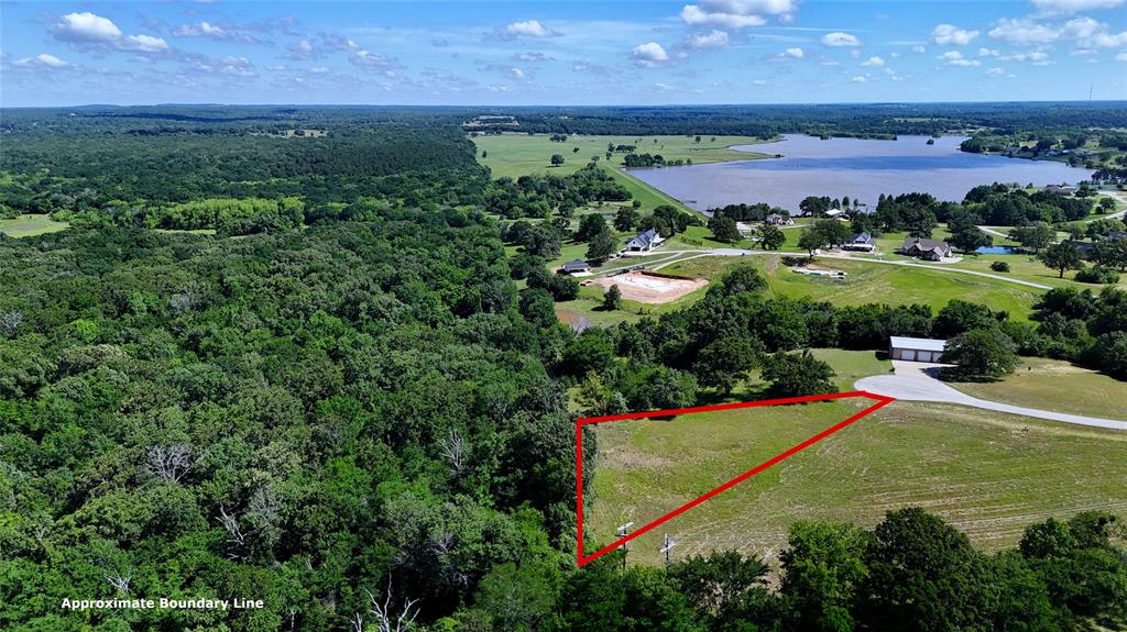 Beautiful lot at the back of the Waters Edge Ranch gated and restricted community. Plenty of privacy for a great weekend retreat or place to build dream home. Fantastic views, close to the community amenities and lake, with several building sites. Community water and underground electric already at street. Needs septic tank. No mobile homes.