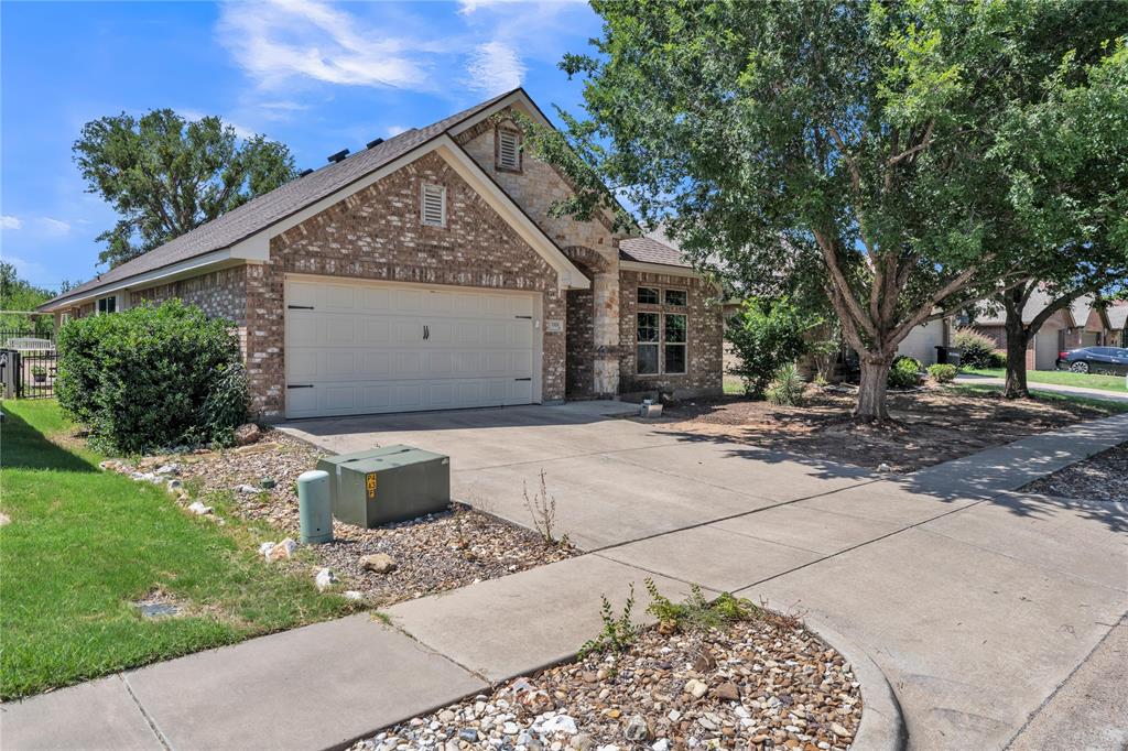 You found it! This beautiful 3-bedroom, 2-bathroom home with just under 2,000 square feet is awaiting its next family. Located on the highly desirable north side of Granbury in the peaceful Lake Forest subdivision, you will love the perfect location, excellent schools, and great neighbors.Step inside to find a versatile formal dining room that easily transitions into a dedicated home office or cozy sitting area. The layout features elegant decorator's ledges throughout, adding unique character and charm to this comfortable floor plan. The home has a fantastic, seamless flow with easy-to-maintain tile in the main areas and cozy carpet in the bedrooms. Enjoy ultimate peace of mind and comfort with a brand-new, energy-efficient HVAC system just installed.Outside, a mature front tree provides excellent shade from the Texas heat. The backyard features a stunning wrought iron fence perfect for low-maintenance city living, with convenient gated access on both sides and a charming brick walkway on the right. A separate workshop fully equipped with electricity stays with the property, and the attic offers plenty of extra space for your storage needs.