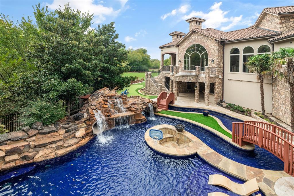 Rare gem in Frisco’s Stonebriar Creek Estates!  Situated on an impressive 2.3-acre lot in the heart of Frisco, 13 Cliff Trail offers unparalleled luxury and space for living and entertaining. Inside, the chef’s kitchen and thoughtfully designed interiors cater to both grand gatherings and everyday living. The expansive single level, open floor plan flows effortlessly through sunlit living areas and opens to elegant outdoor entertaining spaces. Outside, the sprawling turf yard offers a low-maintenance, lush backdrop, while the crown jewel of the property is the resort-sized pool—a private paradise perfect for entertaining or relaxing. Adding to the home’s unique appeal is an indoor sport court, perfect for year-round recreation and fitness. With its blend of breathtaking outdoor amenities, thoughtful design, and a prime location, this property is a rare gem in the prestigious Frisco community.