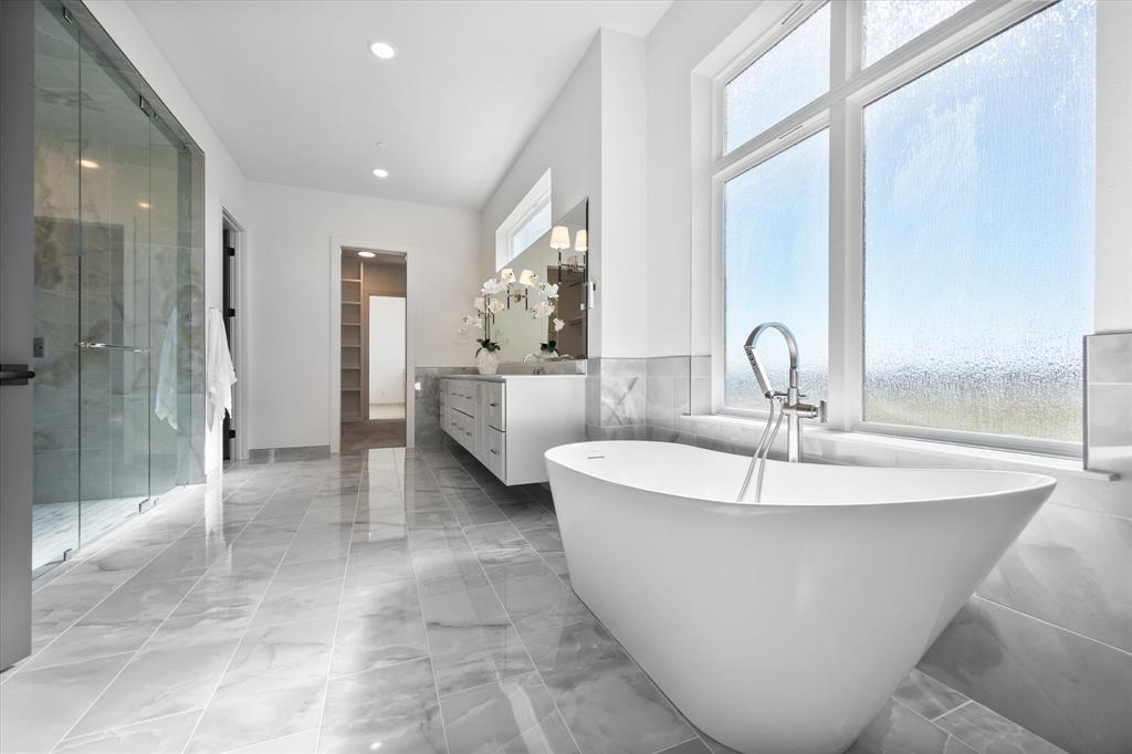 OFFERED AT $2,049,000 with current bed and bath configuration OR at $2,100,000 with the extra bedroom and bathroom addition!! Great flexibility to customize this incredible prairie modern home by Windmiller Homes. Featuring high-end finishes and quality construction elements throughout, this home is not only beautiful but energy efficient. No detail overlooked in this home! The main level includes a gorgeous chef's kitchen with Cambria quartz countertops, ample cabinets, and SS Cafe appliances; large family room and dining room featuring custom drop down ceilings with LED backlighting; large windows allowing in natural light; 3 oversized garages; a HUGE master suite with sitting room, coffee bar, and dual master closets; the perfect secondary master adjacent to the single car garage with its own private entry and kitchenette; Media room with French doors; and a private study. Upstairs you will find 2 more HUGE bedrooms with their own private bathrooms, and a half bath that is easily accessible from the amazing entertaining spaces featuring a game room, a snack area, and a second media or playroom.