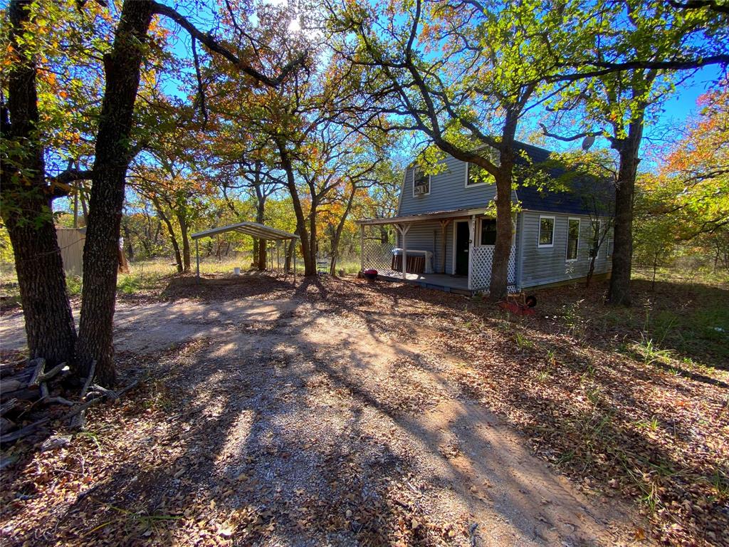 7.12 Acres more or less.The property is heavily wooded with mature oak trees, a seasonal creek and lots of deer & turkey. The property has a 2 story, 1 bedroom & 1 smaller room that could work as a 2nd bedroom and 2 bathrooms. The home is liveable but needs some TLC to make it a wonderful weekend getaway.