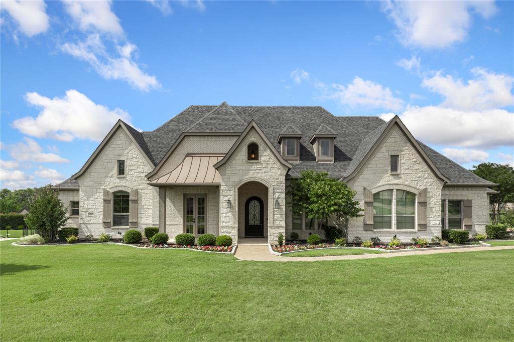 Perfectly positioned on a one-acre homesite within a prestigious gated community, this extraordinary executive estate has been completely transformed through an extensive luxury remodel in designer renovations and system upgrades. Offering refined living space, every detail of this six-bedroom, 6.1-bath residence was intentionally curated to deliver elevated style, comfort, and functionality.Designed for both grand-scale entertaining and multigenerational living, the home features a rare private living quarters with its own separate entrance, two bedrooms, two baths, living area with fireplace, kitchenette, and dedicated laundry space, creating the ideal setup for extended family, long-term guests. At the center of the home, the completely reimagined chef’s kitchen showcases a commercial-grade Thermador range, premium appliances, built-in refrigerator, custom cabinetry, designer lighting, and stunning finishes throughout. New hardwood flooring flows seamlessly across the home, complemented by elevated architectural details, a dedicated wine room, tiered media room, and beautifully redesigned living spaces filled with warmth and sophistication. The luxurious primary suite offers a true spa-inspired retreat with a dramatic walk-through shower and designer finishes that rival a five-star resort. Significant infrastructure upgrades include new HVAC units, new ductwork, and spray foam insulation for enhanced comfort and energy efficiency. Every closet has been customized with premium Elfa storage systems..Outside, the backyard has been transformed into a private luxury oasis featuring a resort-style pool, outdoor kitchen with gas grill, outdoor fireplace, and expansive entertaining areas designed for unforgettable evenings with family and friends. The oversized four-car garage features epoxy flooring. Internal tornado safe room. Prosper ISD. This is a rare opportunity to own a fully reimagined luxury estate in one of Prosper’s most sought-after gated communities.