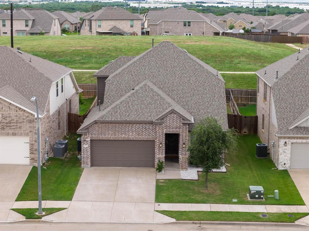 Welcome to 14613 Martin Creek Cove, a beautifully maintained home tucked away in one of North Fort Worth's sought after communities. Offering a flexible office space, spacious game room, and a thoughtfully designed floor plan, this home provides the space and flexibility you are looking for. Step inside to find bright, open living spaces filled with natural light and designed to make everyday living comfortable and functional. The open concept layout creates a seamless flow between the main living areas while still offering distinct spaces for work, relaxation, and recreation. The kitchen is the heart of the home, featuring abundant cabinet storage, generous counter space, and a layout that makes meal prep and daily routines effortless. The adjoining dining and living areas provide an open and airy feel, making the home feel even larger than its impressive footprint. The primary suite offers a peaceful retreat with plenty of room for oversized furnishings and a private ensuite bath designed for comfort and convenience. Three additional bedrooms provide flexibility for family members, guests, or additional workspace. With three full bathrooms, busy mornings and overnight guests are easily accommodated. One of the standout features of this home is its versatility. The dedicated office provides the perfect work from home setup, study area, or creative space, while the spacious game room offers endless possibilities for a media room, playroom, fitness area, or second living space. Whether your needs are changing or you're simply looking for room to spread out, this floor plan adapts beautifully to a variety of lifestyles. Outside, the backyard offers plenty of usable space to enjoy the outdoors while remaining easy to maintain. Beyond the home itself, residents enjoy access to exceptional HOA amenities that enhance everyday living. The neighborhood is known for its welcoming atmosphere, attractive common areas, and amenities that add value long after move in day.