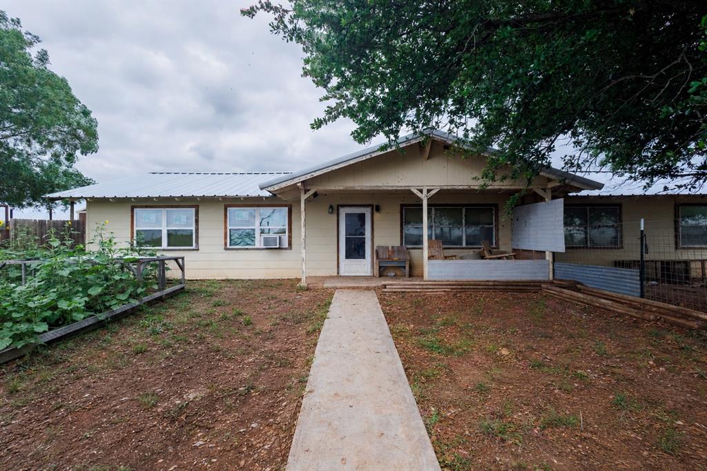 This 4-bedroom, 2-bath home on 5 usable acres offering great potential for investors or buyers looking to renovate and customize. Approximately 2,500 sq ft with open-concept living, wood flooring, spacious kitchen with island, and large primary suite with walk-in closet.
Located outside city limits with FM road frontage, this property offers flexibility for homestead, livestock, recreational, or investment use. Multiple outbuildings, storage sheds, livestock shelter, fenced areas, and plenty of usable land provide endless possibilities. Home will need clean-out and updates. Central AC is older and currently not working. New metal roof scheduled for completion by end of 2025. Great opportunity to add value and make it your own.